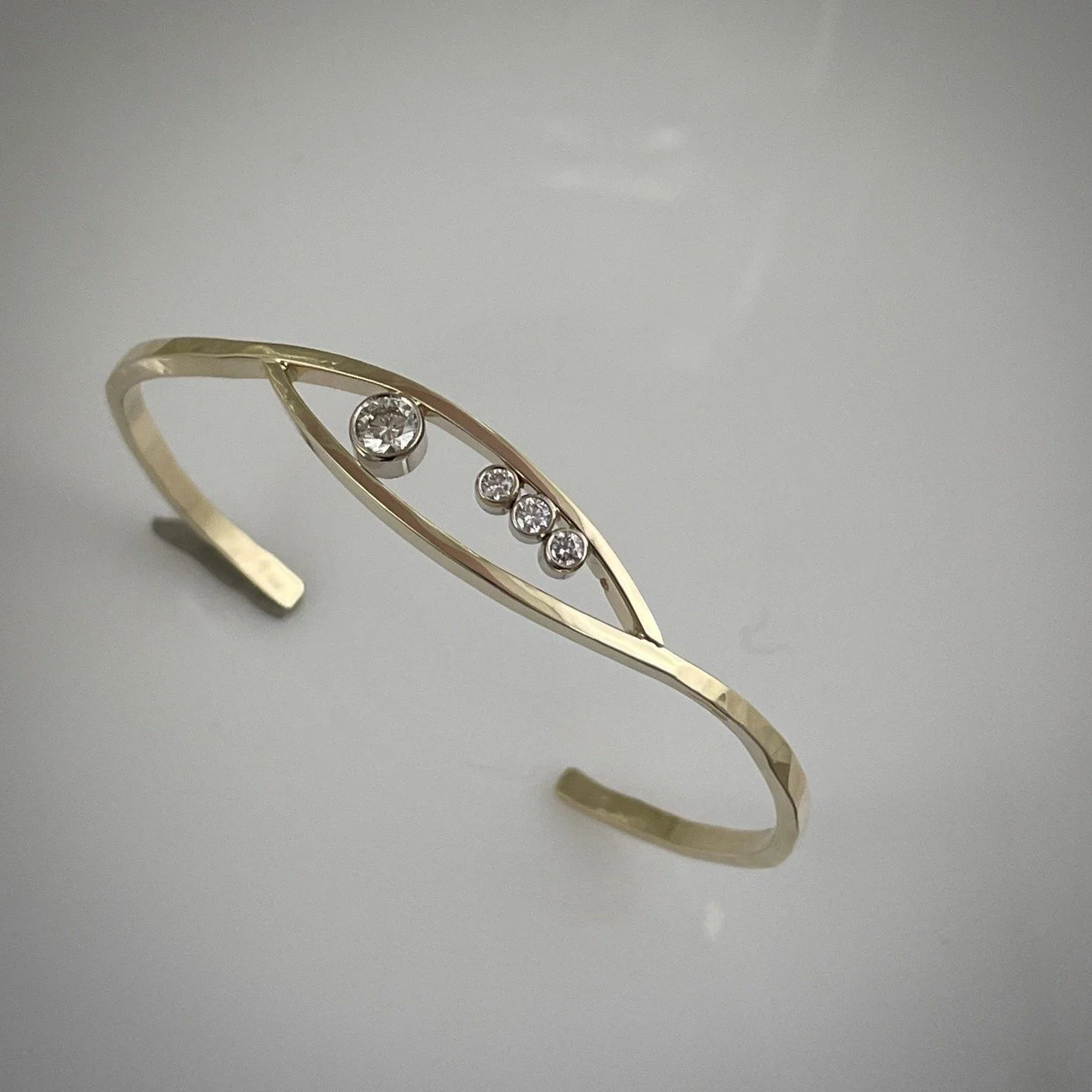 ANOTHER HOT ONE OFF THE BENCH
14k yellow gold cuff bracelet with .89ctw in diamonds--3900.00