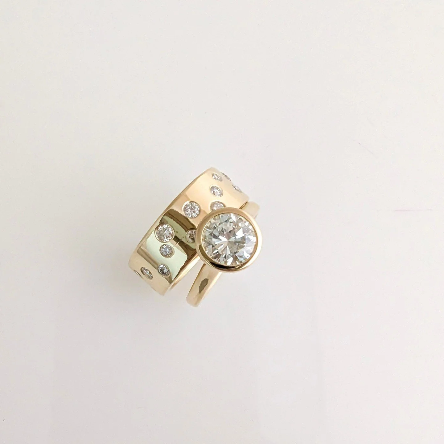 April&rsquo;s birthstone = forever: the diamond 💎⁠
⁠
The hardest natural substance on Earth&mdash;once used to engrave other gemstones! ✨⁠
Here&rsquo;s a custom 18k gold diamond ring stack, made to shine. 1.50ct solitaire and 0.71cttw scattered band