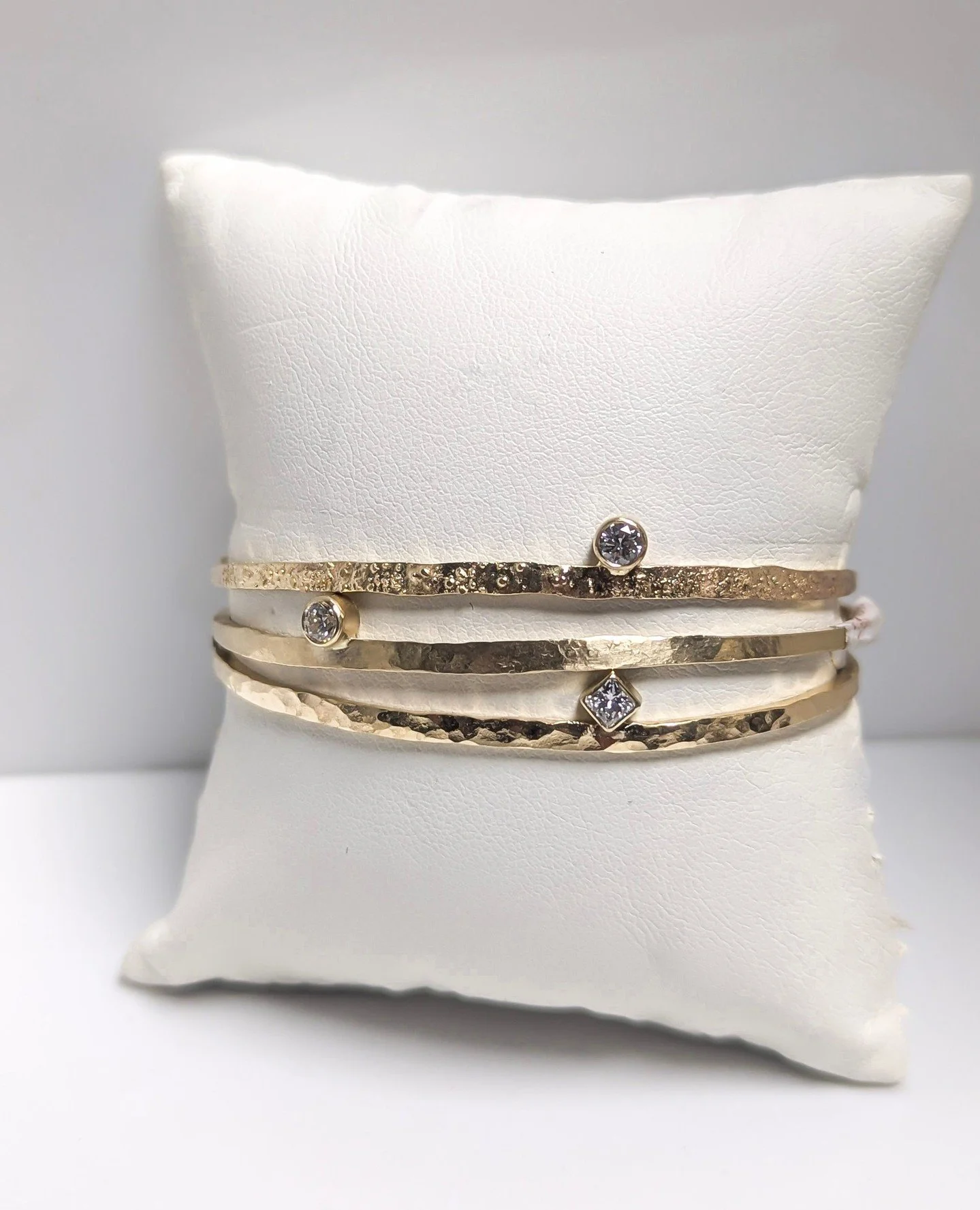 Mother's Day is around the corner. Stop by to see what we have in stock to surprise mom! ✨️⁠
⁠
Cuffs by Rocky Pardo Jewelry⁠
textured 14k yellow gold with 0.2 - 0.25ct diamonds⁠
oxidized sterling silver wide cuffs with 18k yellow gold dust
