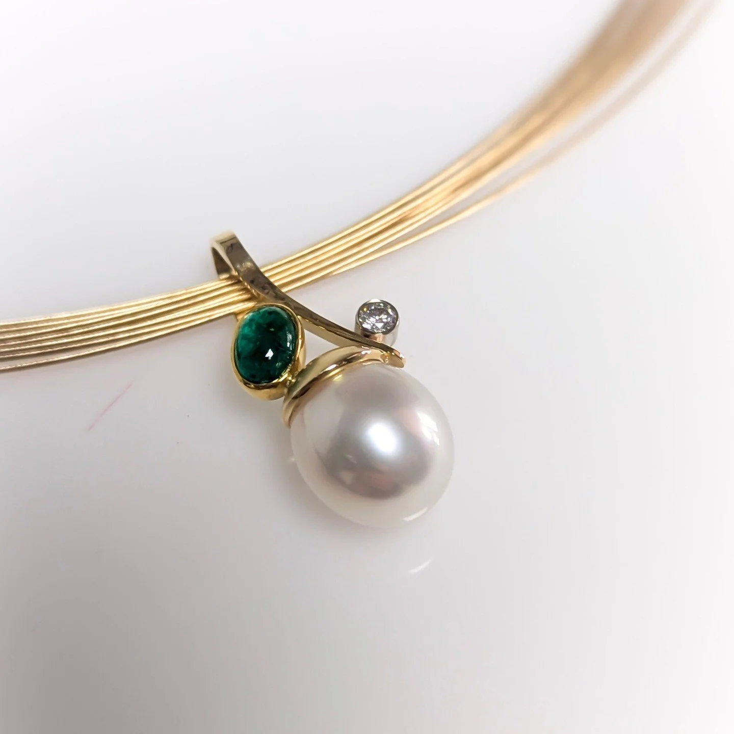 Emeralds for May&mdash;because a little luck and a lot of sparkle (with this gorgeous pearl and diamond) goes with every event.
