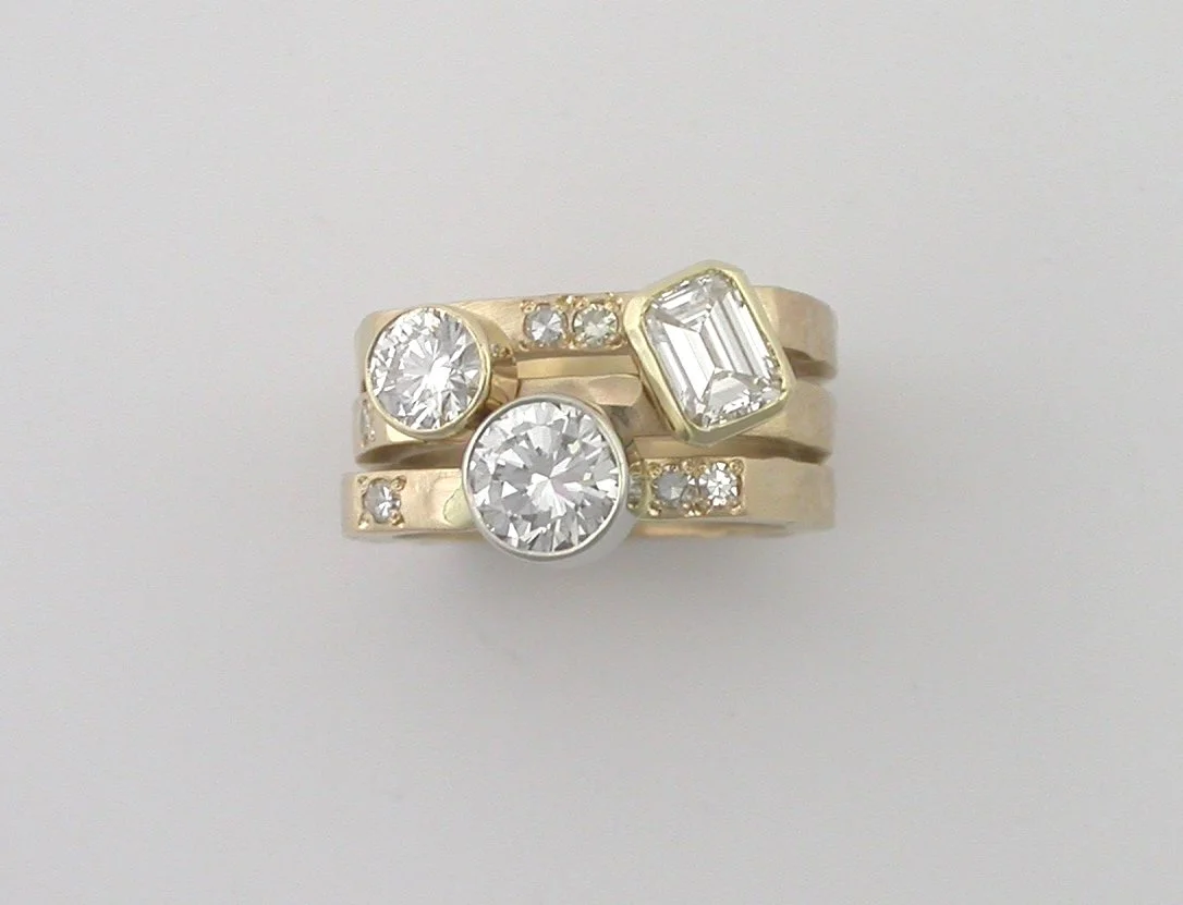 Three gold rings with diamonds, stacked together. Perfect for everyday wear or engagement.