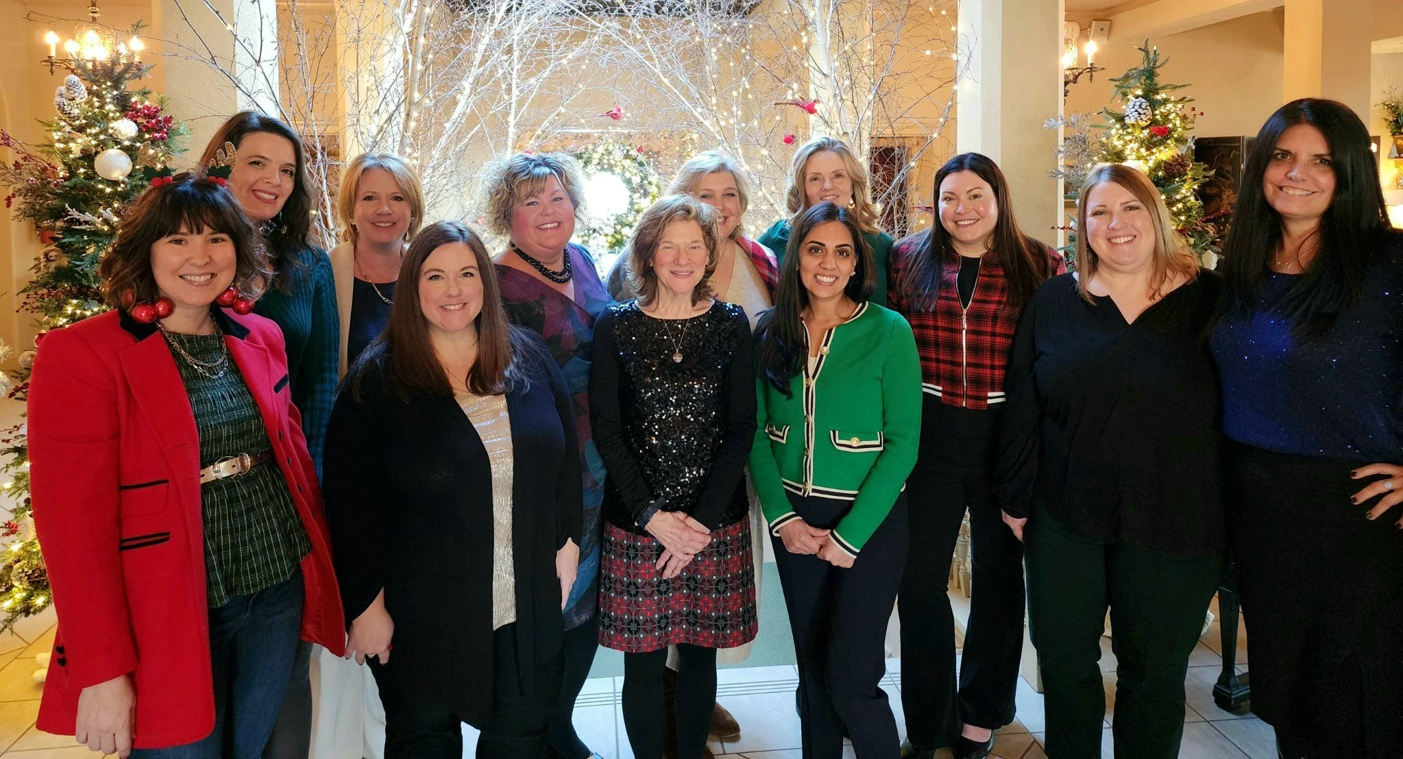 Women in leadership group photo at Christmas event.