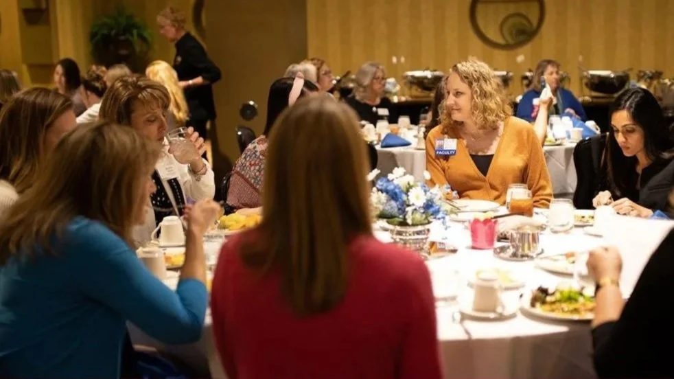 Photo of Women in leadership members at a luncheon event.