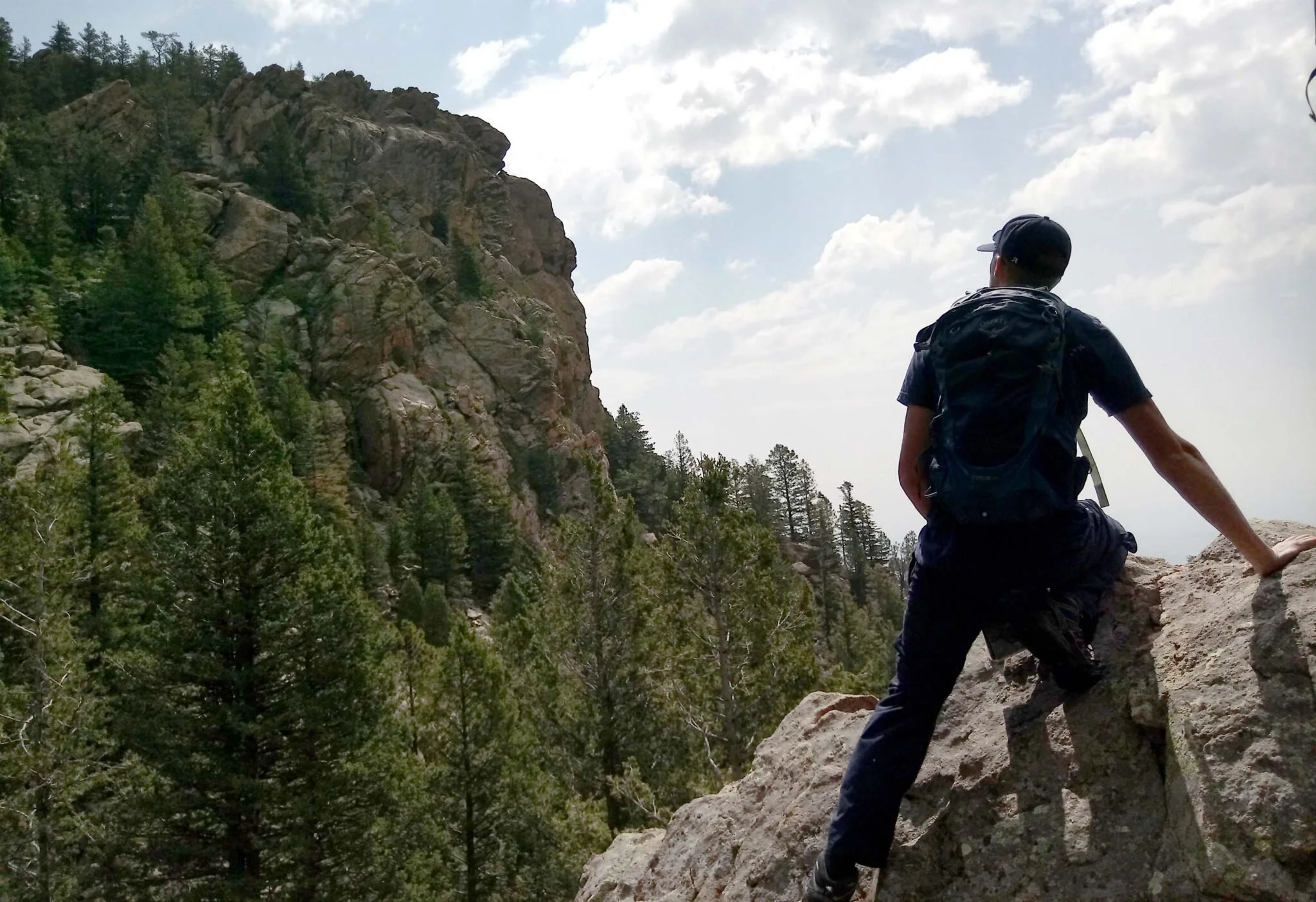 A person hiking up Dixion Trail In Cheyenne Mountain State Park