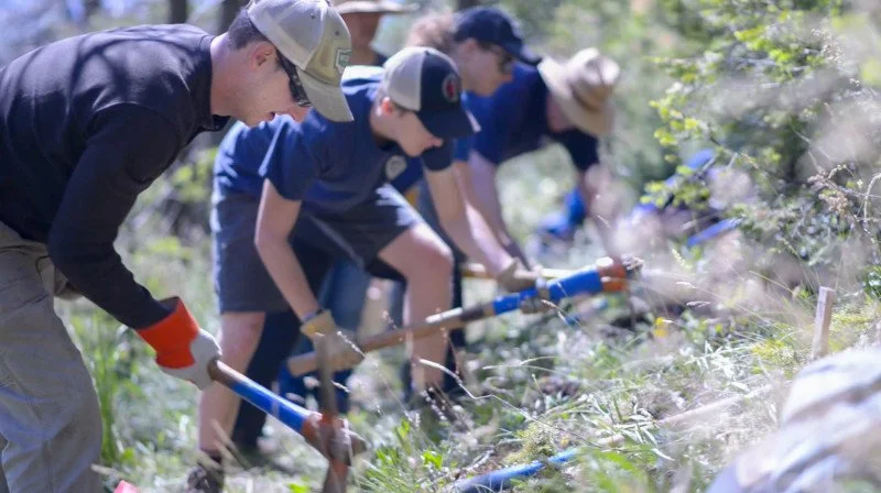 Group of volunteers building trails in Cheyenne Mountain State Park