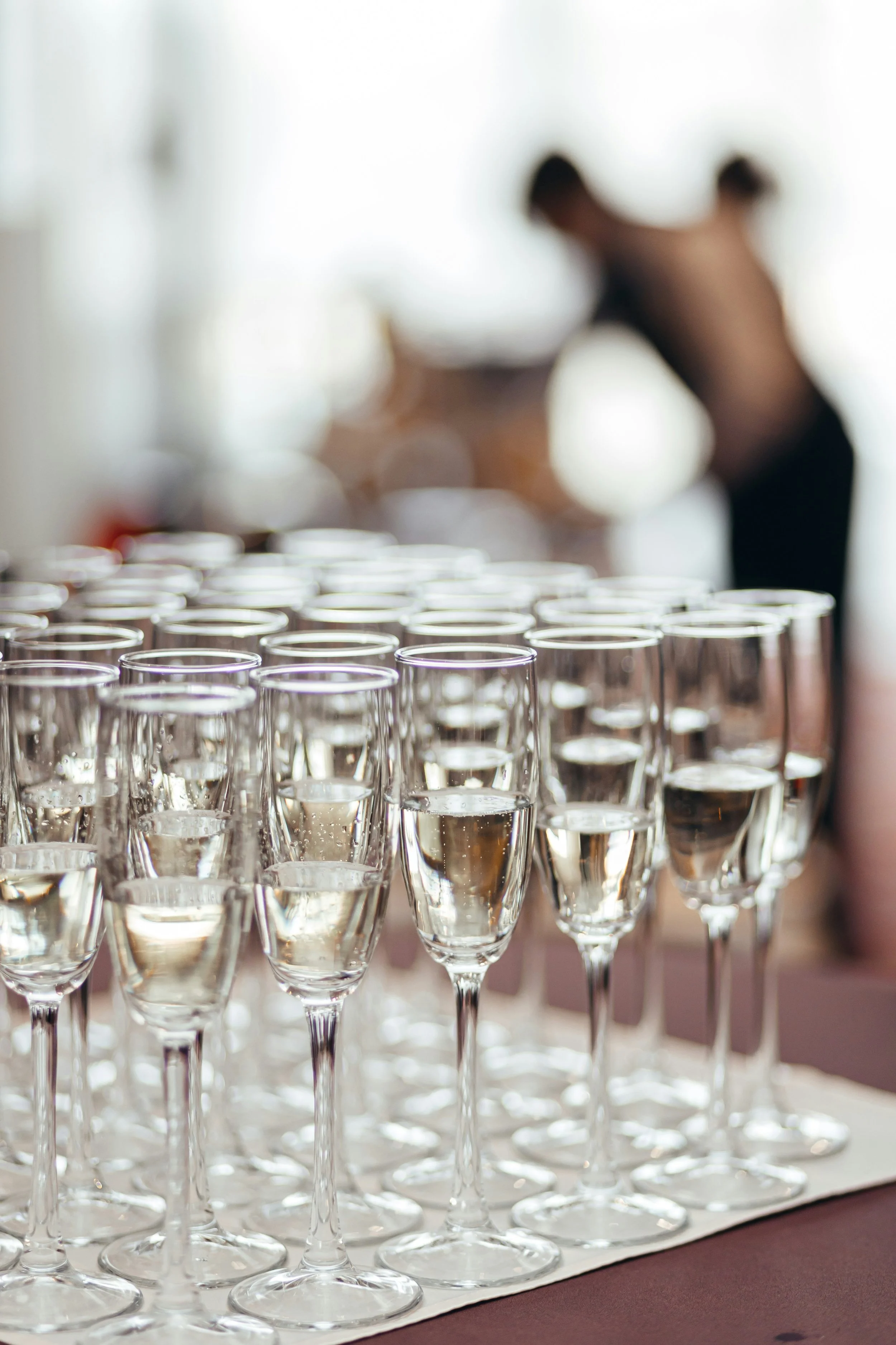 Solo cup bartender displaying a series of champagne flutes in Salt Lake city.