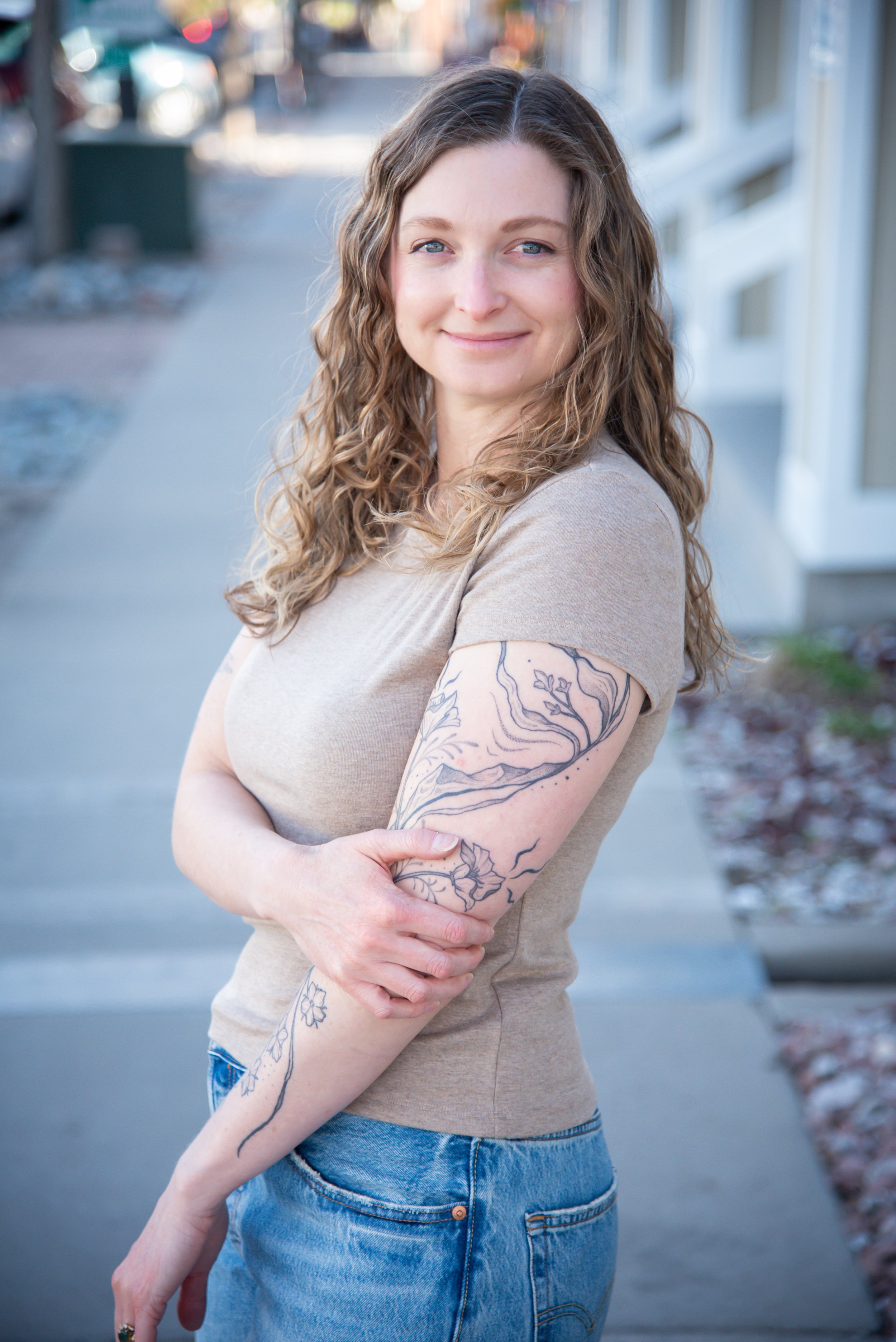 Laura Vogel, licensed therapist in Colorado specializing in anxiety and emotional healing, smiling outdoors