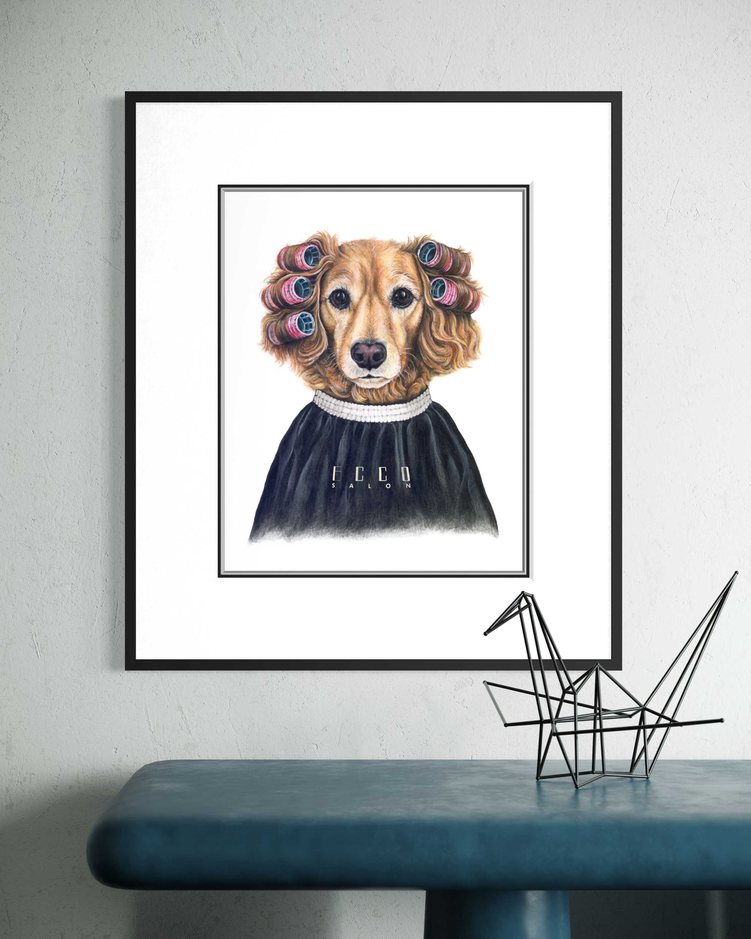 Art print of a dog with hair rollers in a barber cape hanging on a textured white wall in a modern interior