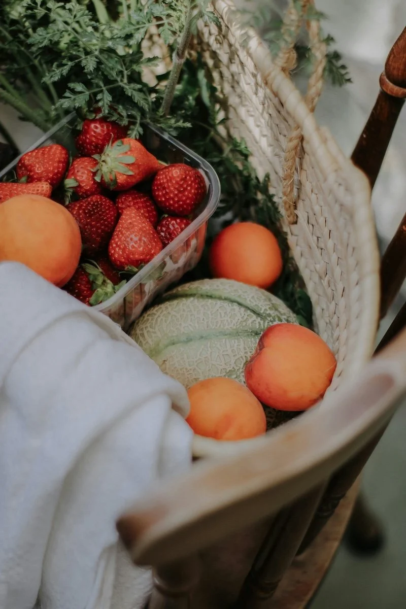 Fresh fruit on wooden board symbolising whole food nutrition