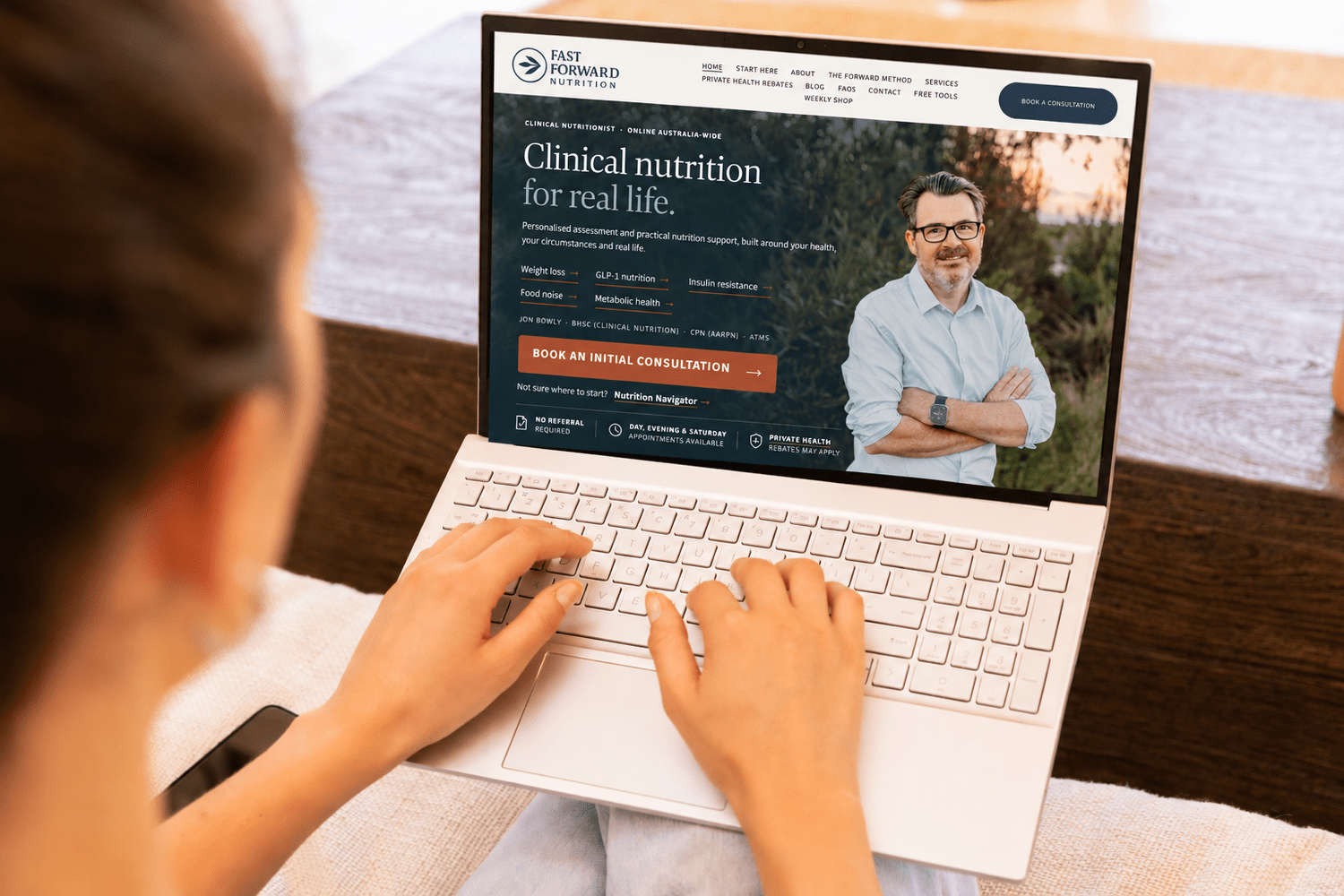 Someone booking an Initial Consultation on a laptop