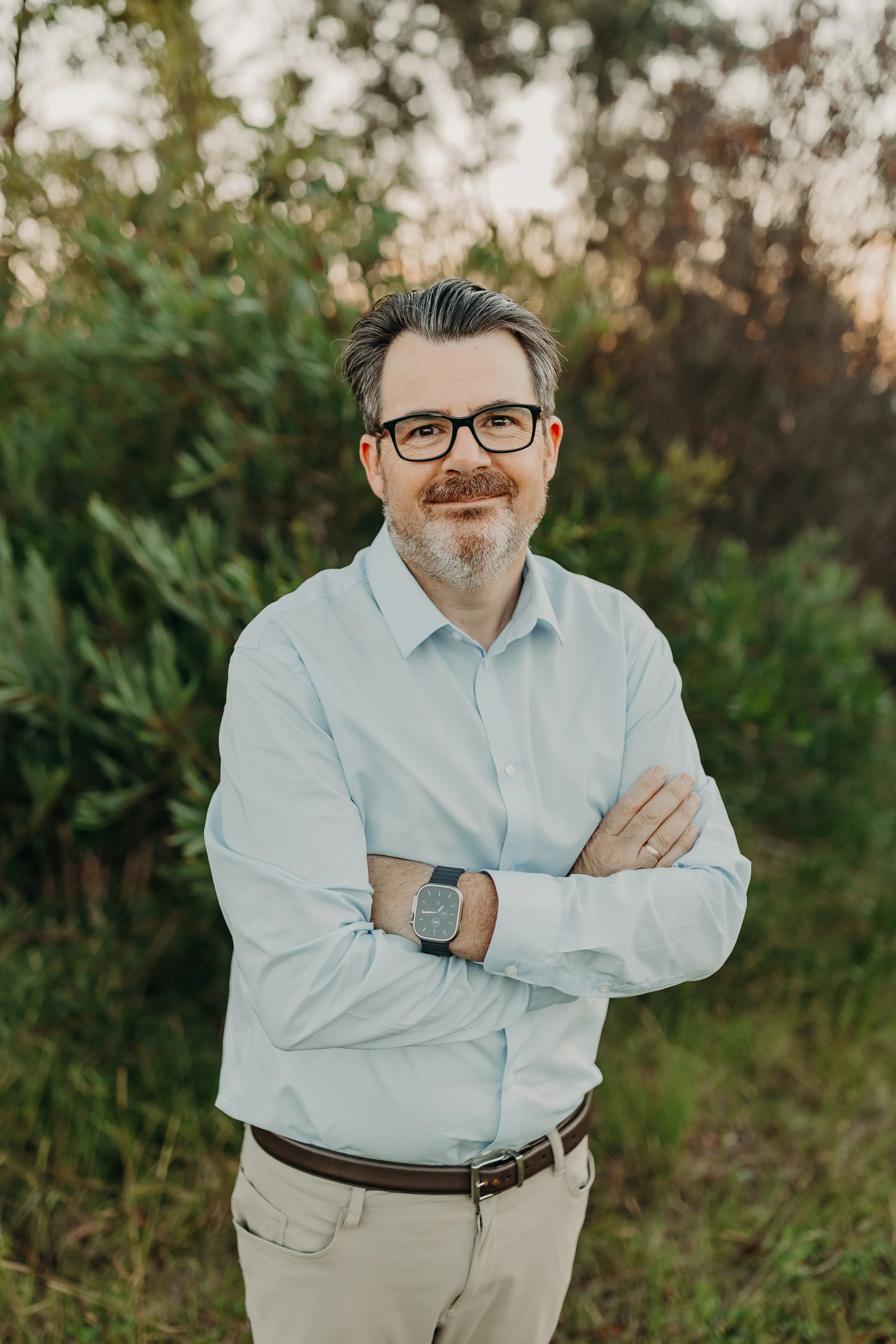 Jon Bowly clinical nutritionist standing outdoors in natural bushland setting