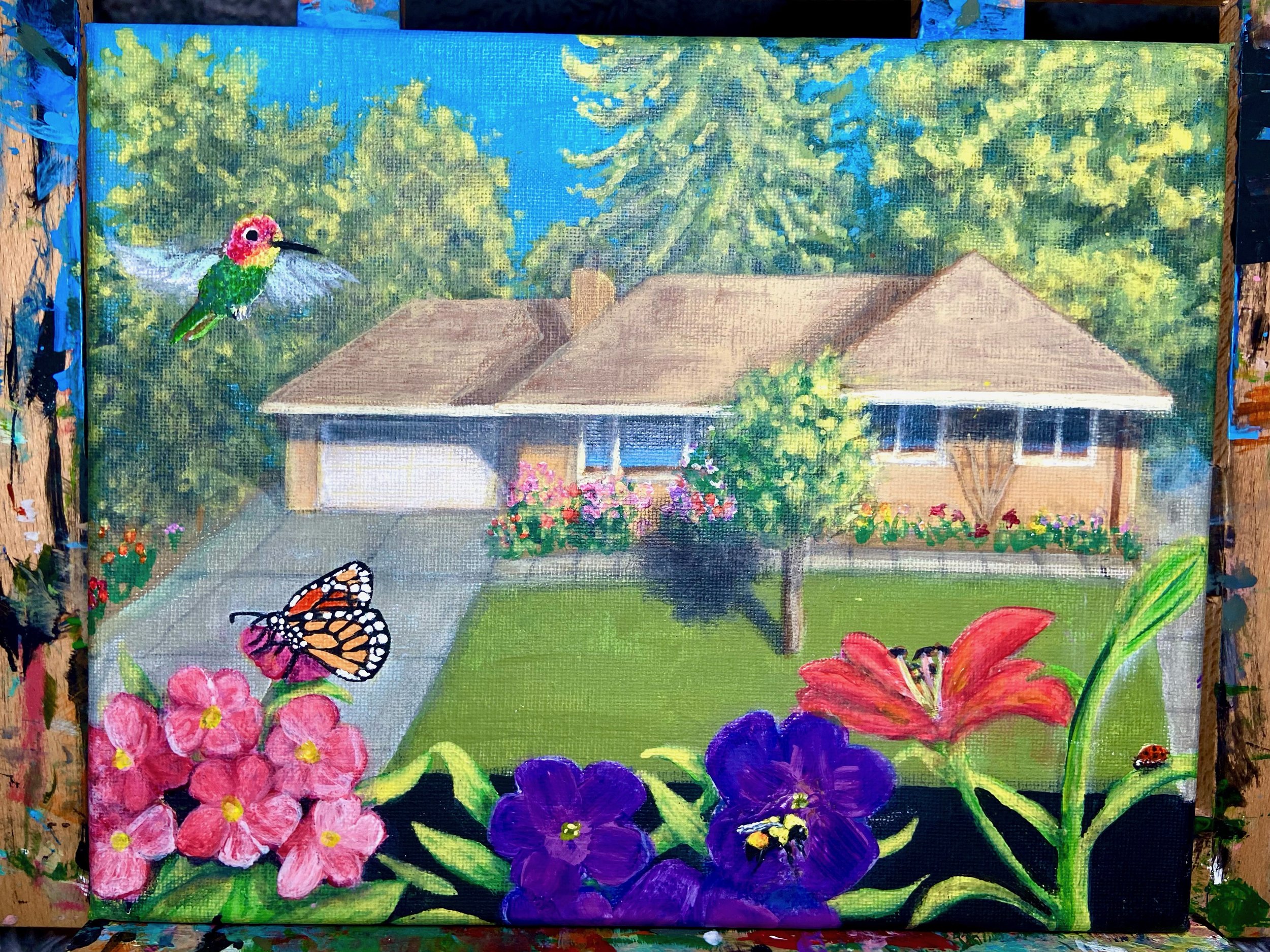A colorful painting of a house with a front lawn, surrounded by trees and flowers. Two bees and a hummingbird are depicted near the flowers, with a butterfly on a pink flower in the foreground.