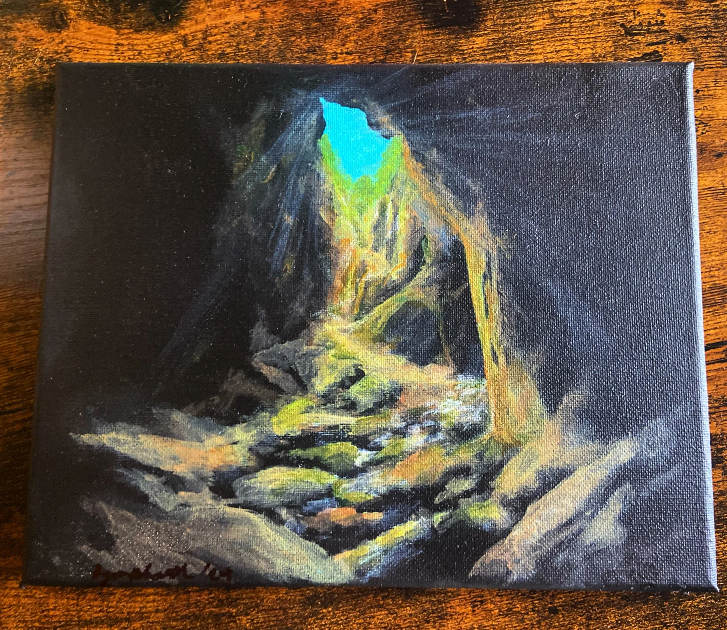 Painted portrait of a person with a rock formation in the background, using dark colors with bright accents.