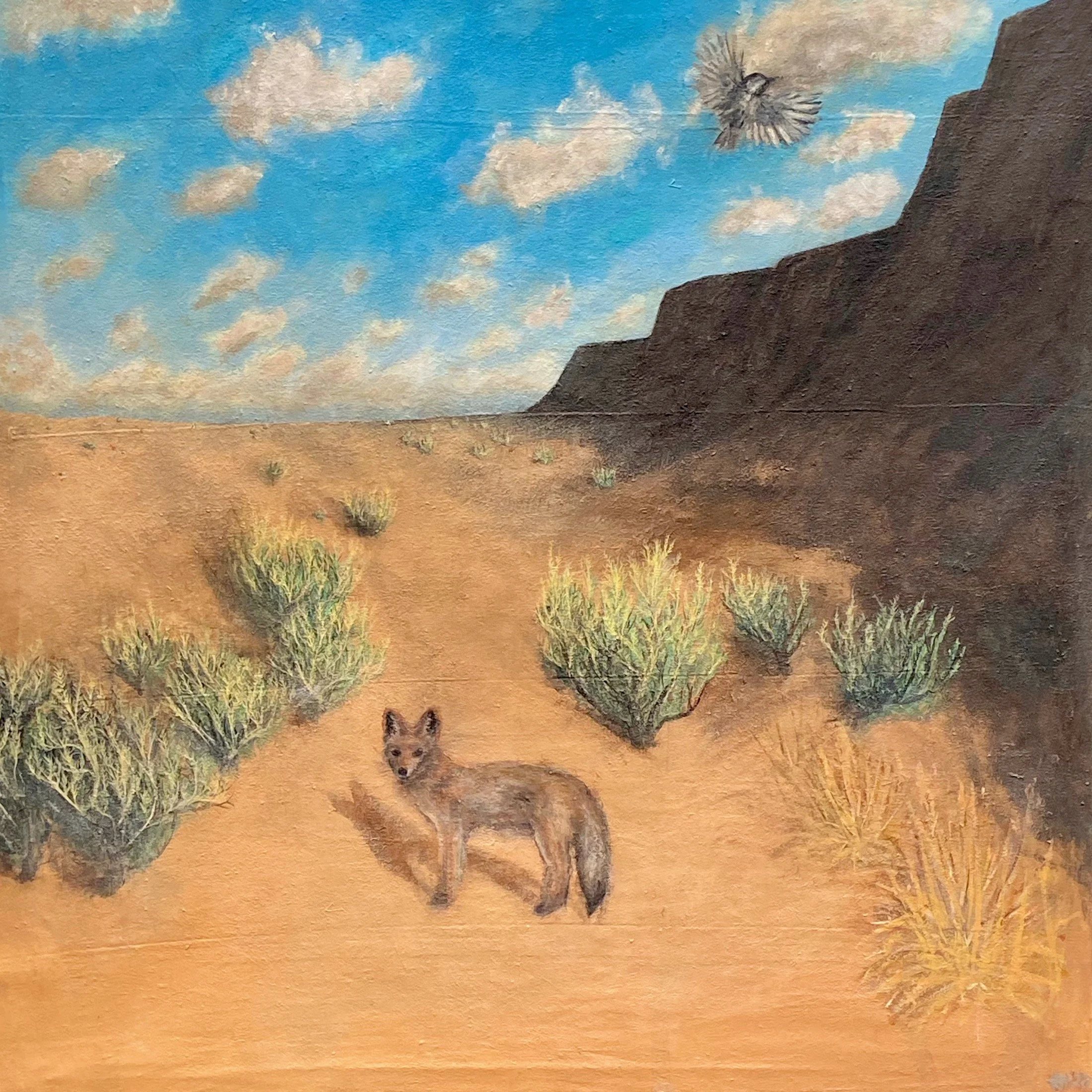 Painting of a desert landscape with sagebrush, a fox, rocky cliffs, a blue sky with clouds, and a bird flying overhead.
