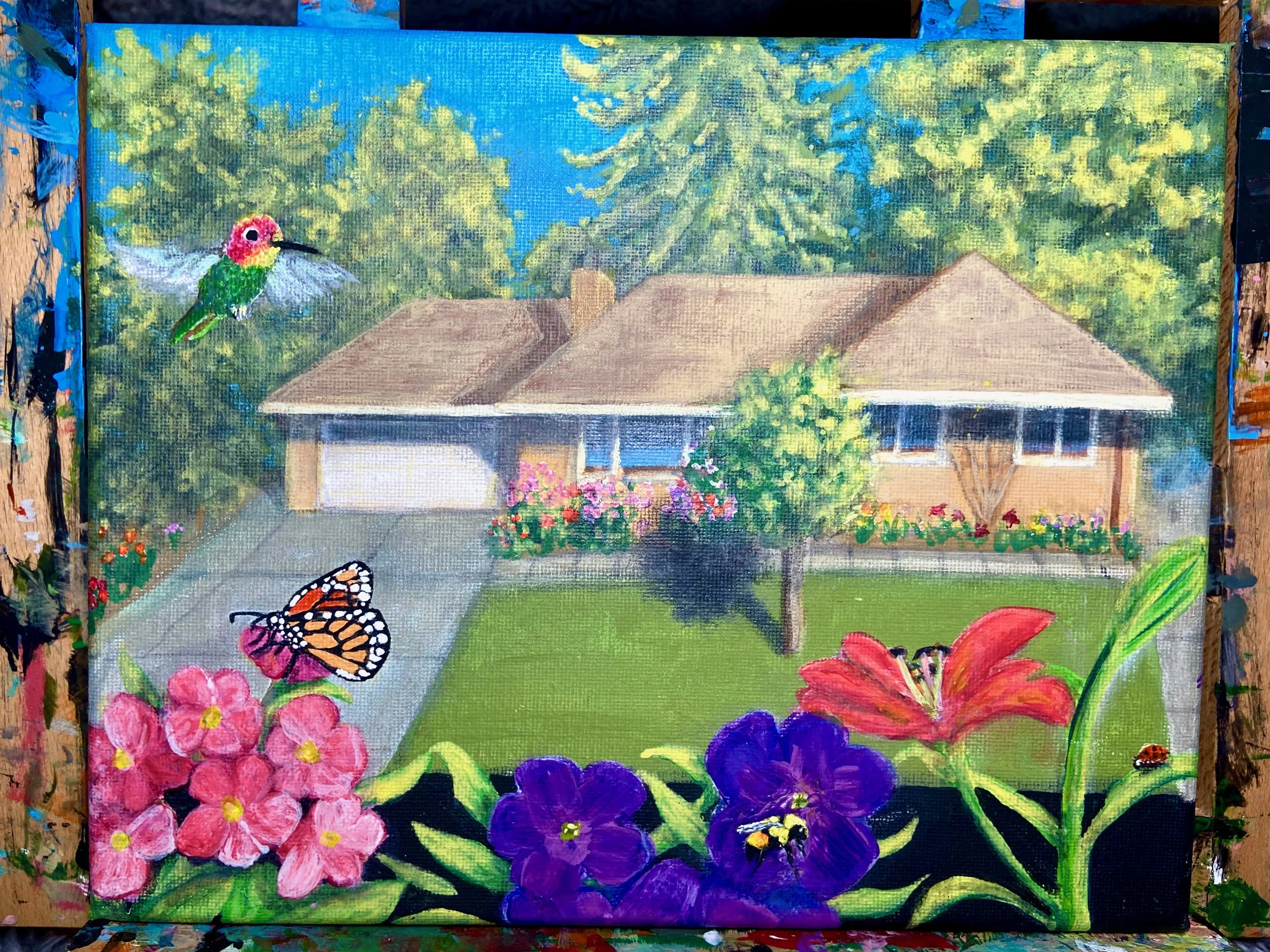 Painting of a suburban house with a front yard, surrounded by colorful flowers, a butterfly, a hummingbird, and a ladybug.