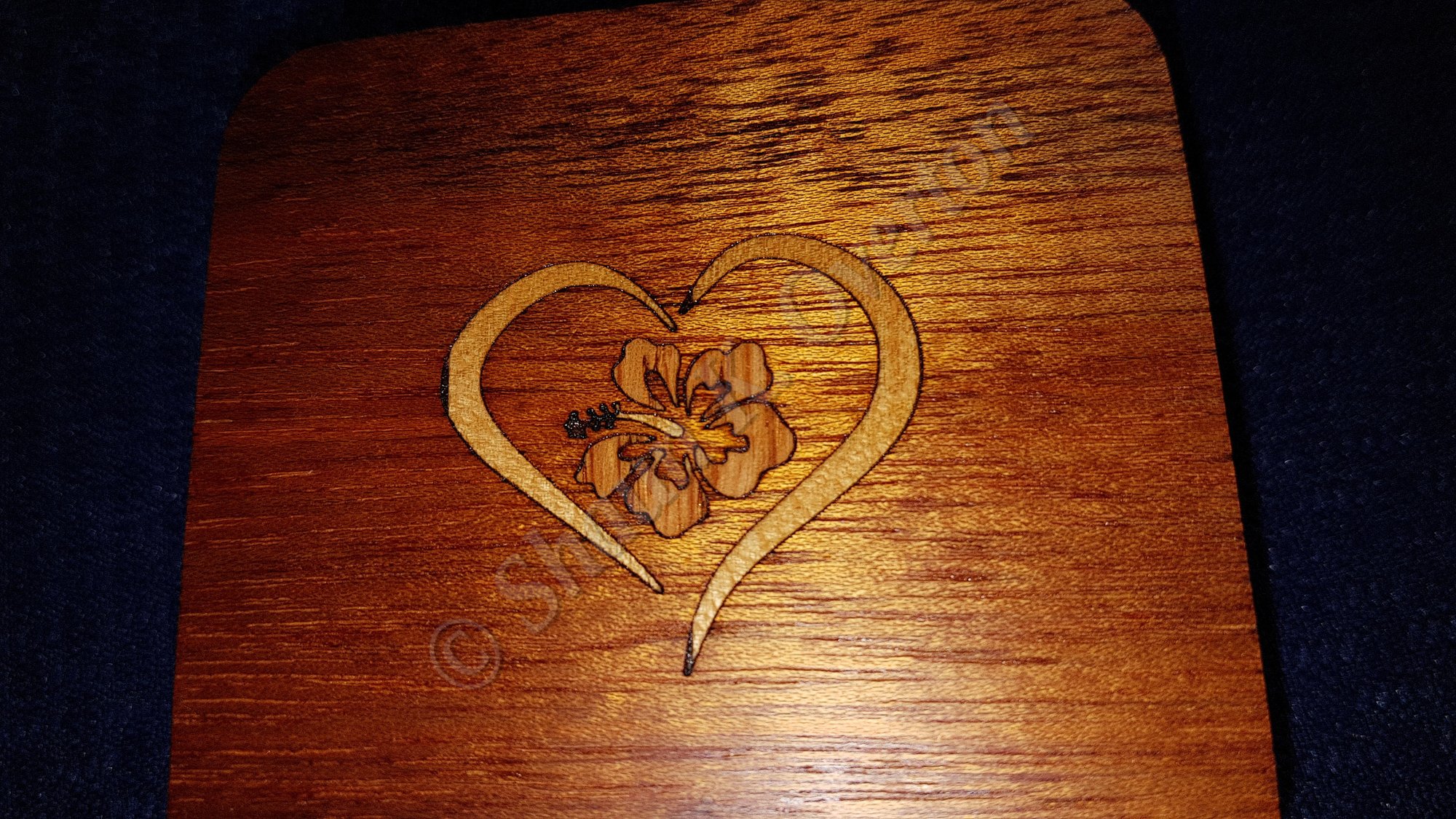 Crafted mahogany box lid with birch and oak inlay.