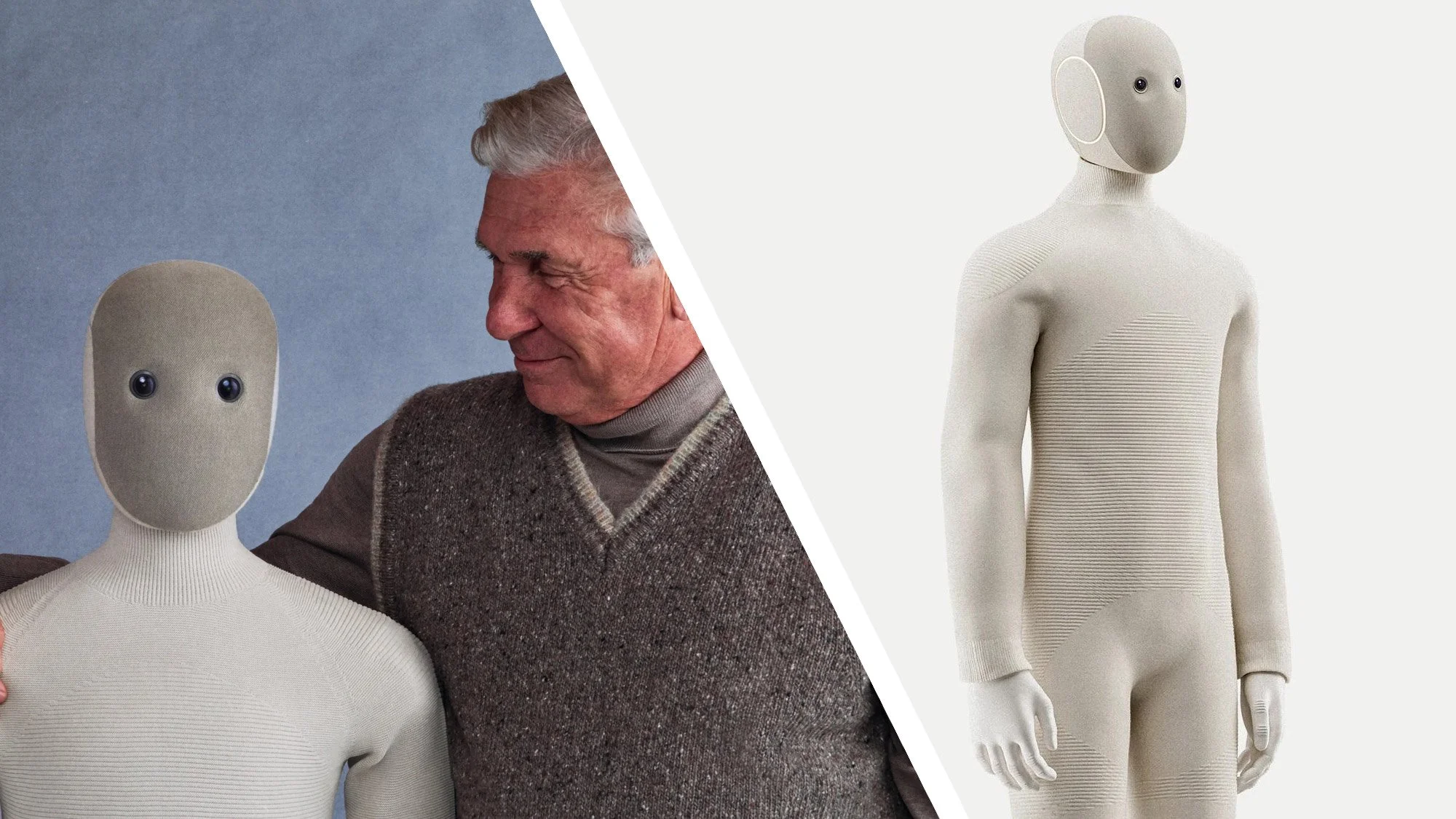 A humanoid robot with a beige fabric covering, black eyes, and a featureless face, positioned on the right side of the image. On the left side, a man with gray hair, wearing a brown sweater and gray turtleneck, is smiling and interacting with the robot against a blue background.