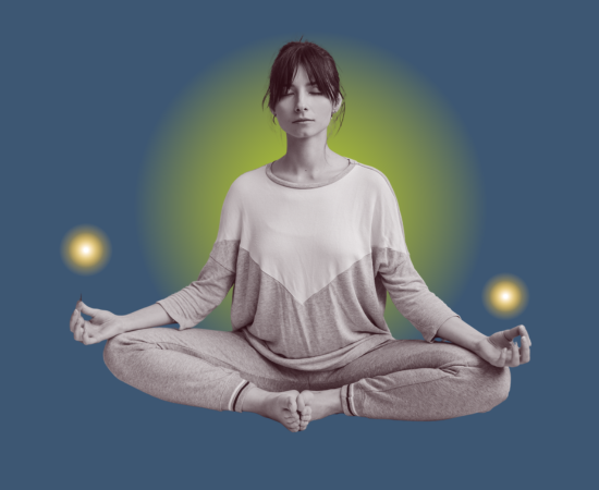 A woman meditating in a cross-legged pose with glowing orbs around her, sitting against a dark background with a greenish glow behind her.
