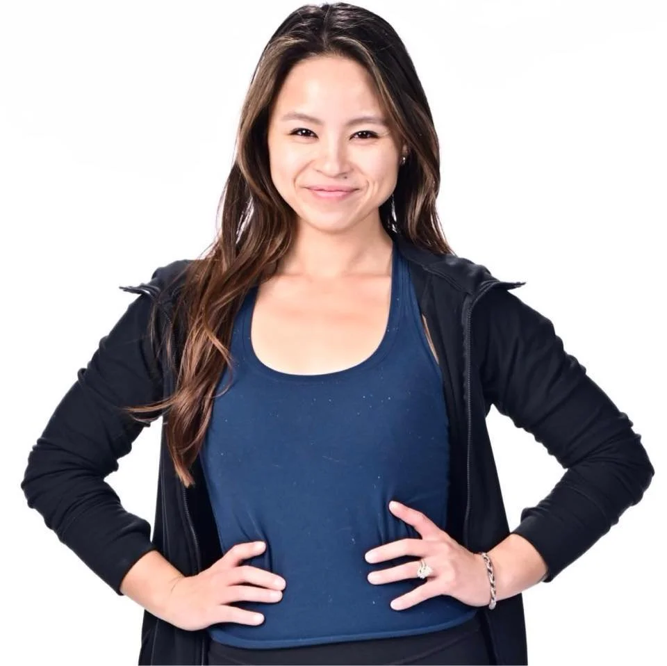 Professional photographer Allison Mott, formerly Allison Cheng, smiling during a gymnastics team and individual portrait session.