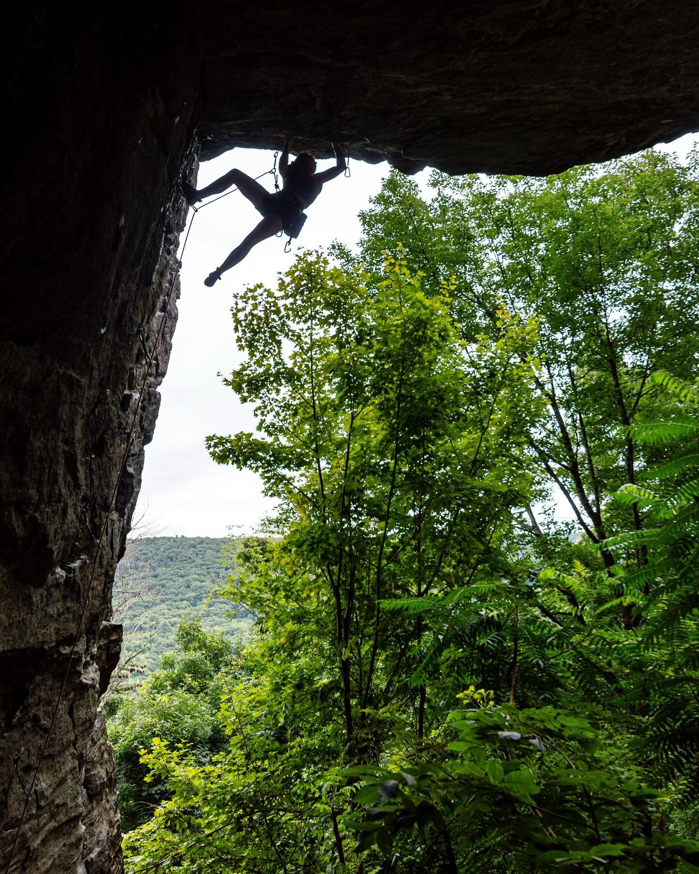 Photographer Allison Mott rock climbing in Massachusetts with her husband, Joseph Mott, providing the belay.