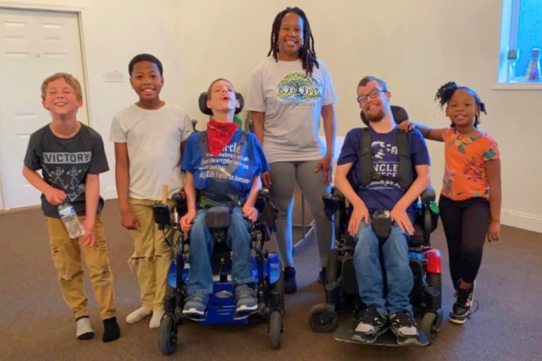Children and adult volunteers of all abilities participate in an inclusive Village Nights gathering together.