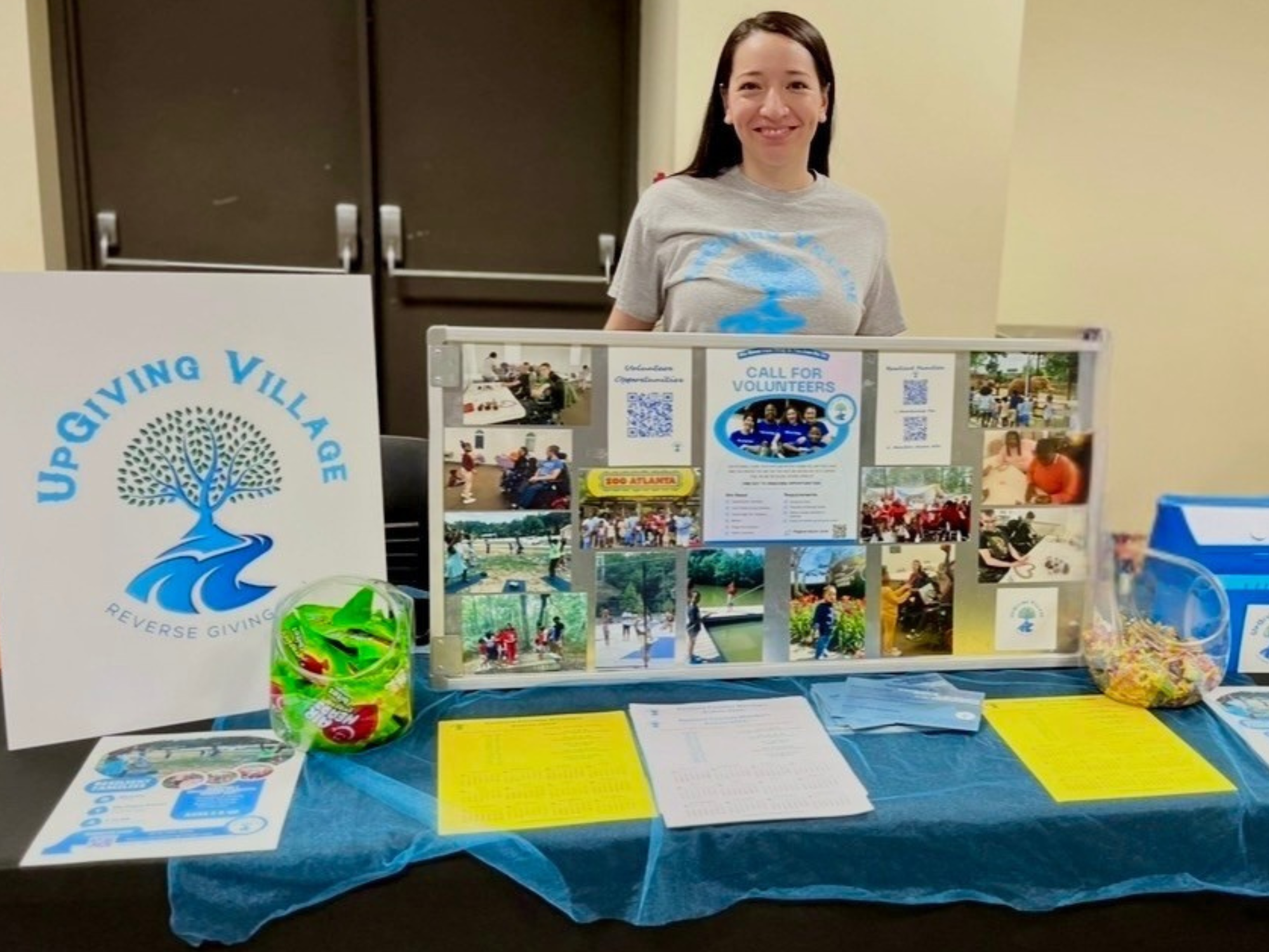 Community volunteers sharing information and engagement opportunities during a local outreach event.