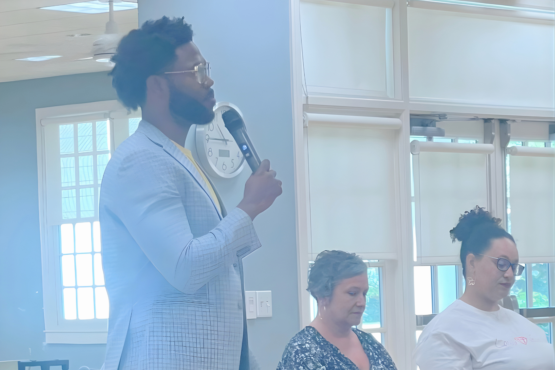 Up Giving Village VP speaking during a Douglas County Commissioner community event, a collaborative discussion focused on mental health advocacy, support, and community impact.
