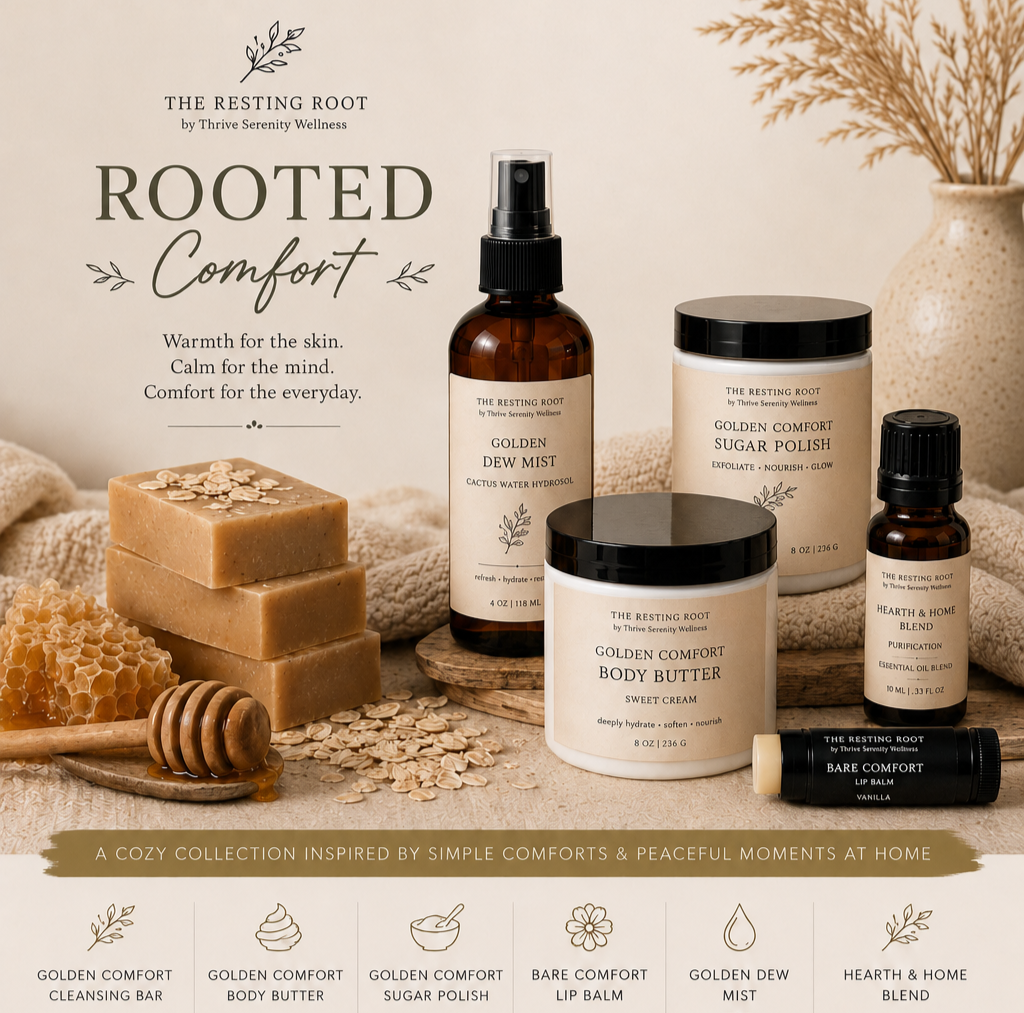 A collection of wellness and skincare products including golden dew mist, sugar polish, body butter, hearth & home blend, and lip balm, arranged on a wooden surface with a backdrop of a beige, textured fabric, honeycomb, honey dipper, and a vase with dried plants.