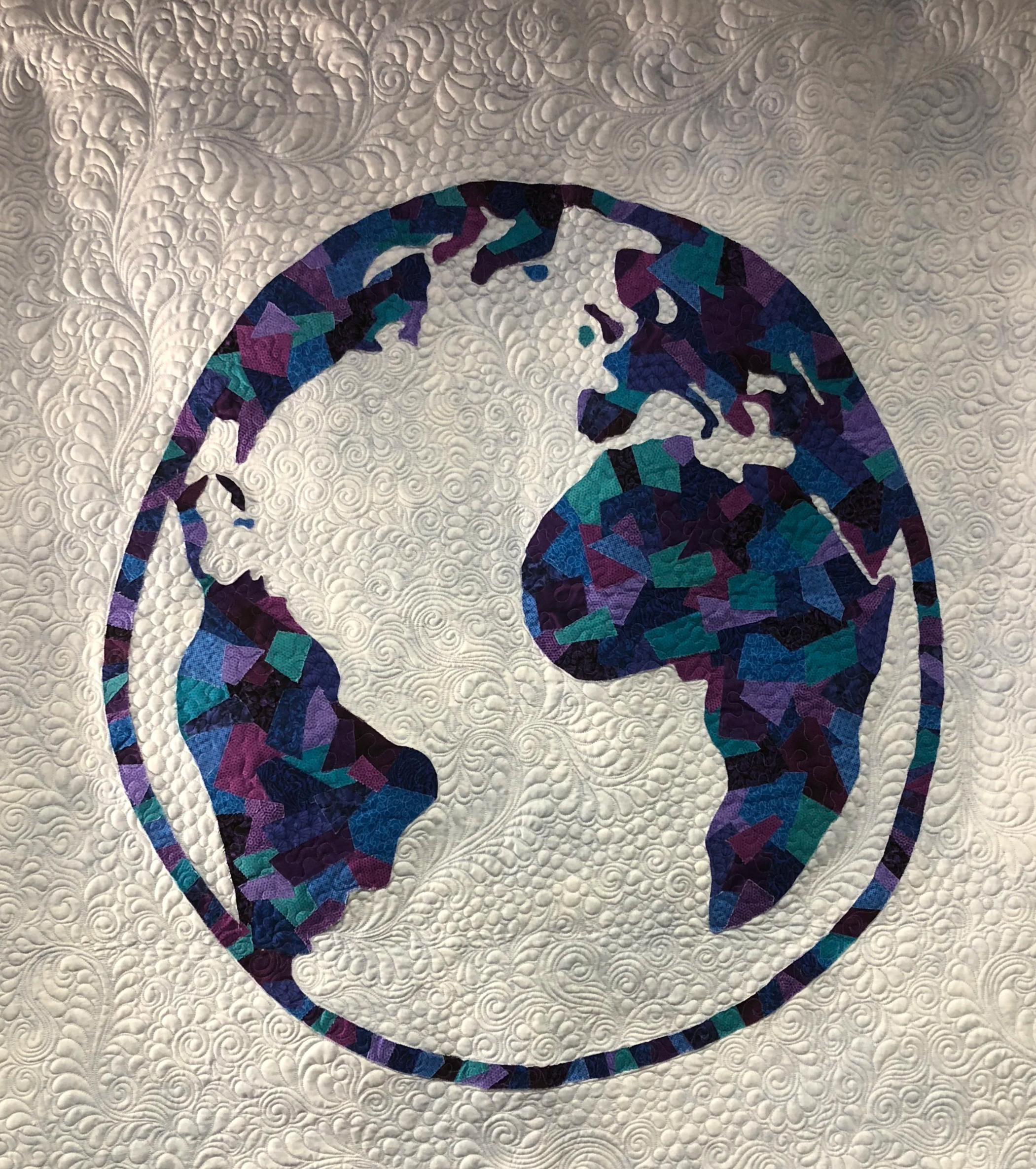 Quilt of the world facing Africa and the Atlantic Ocean in the center.