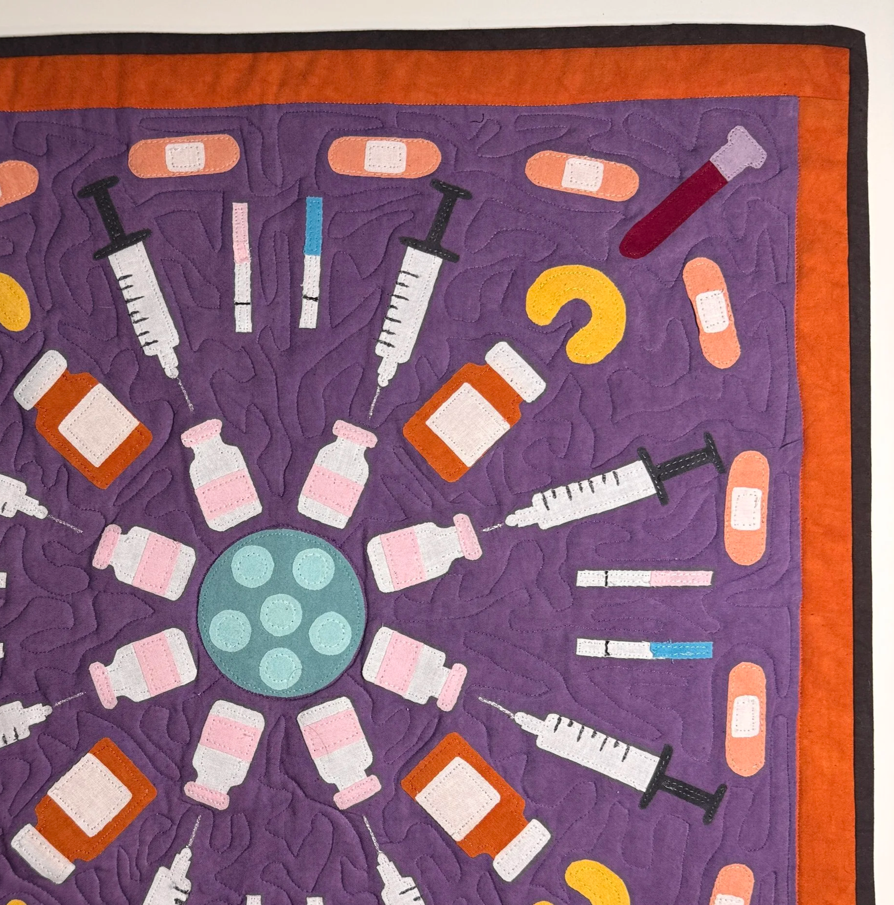 1/4 of a circle of IVF supplies: needles, blood, bandaids, vials, embryos.