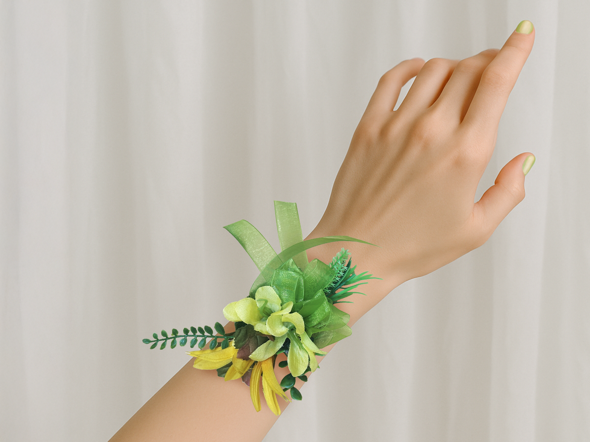 Yellow and Lime corsage on wrist.png