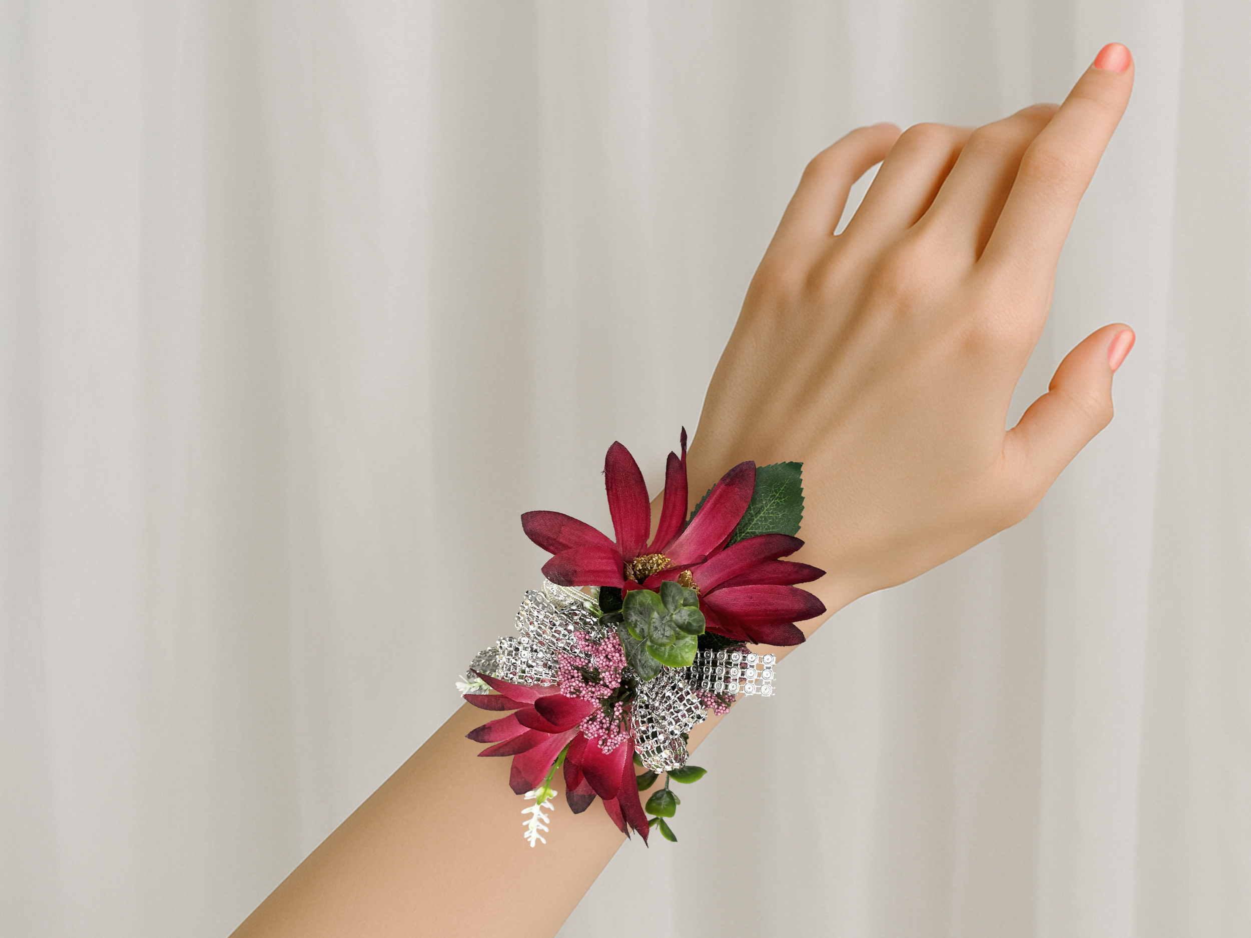 Burgundy corsage on wrist.png