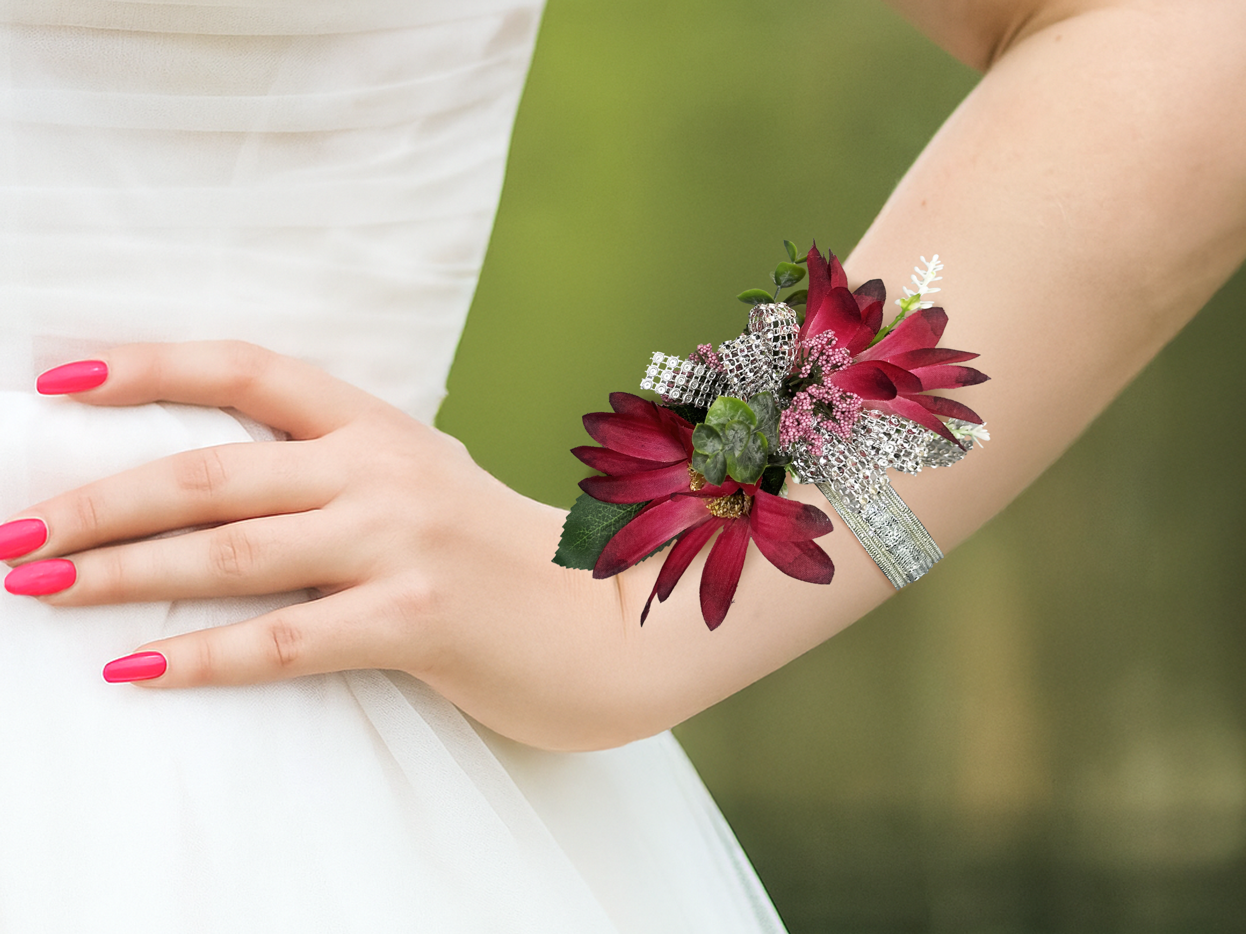 Burgundy corsage on wrist outside.png