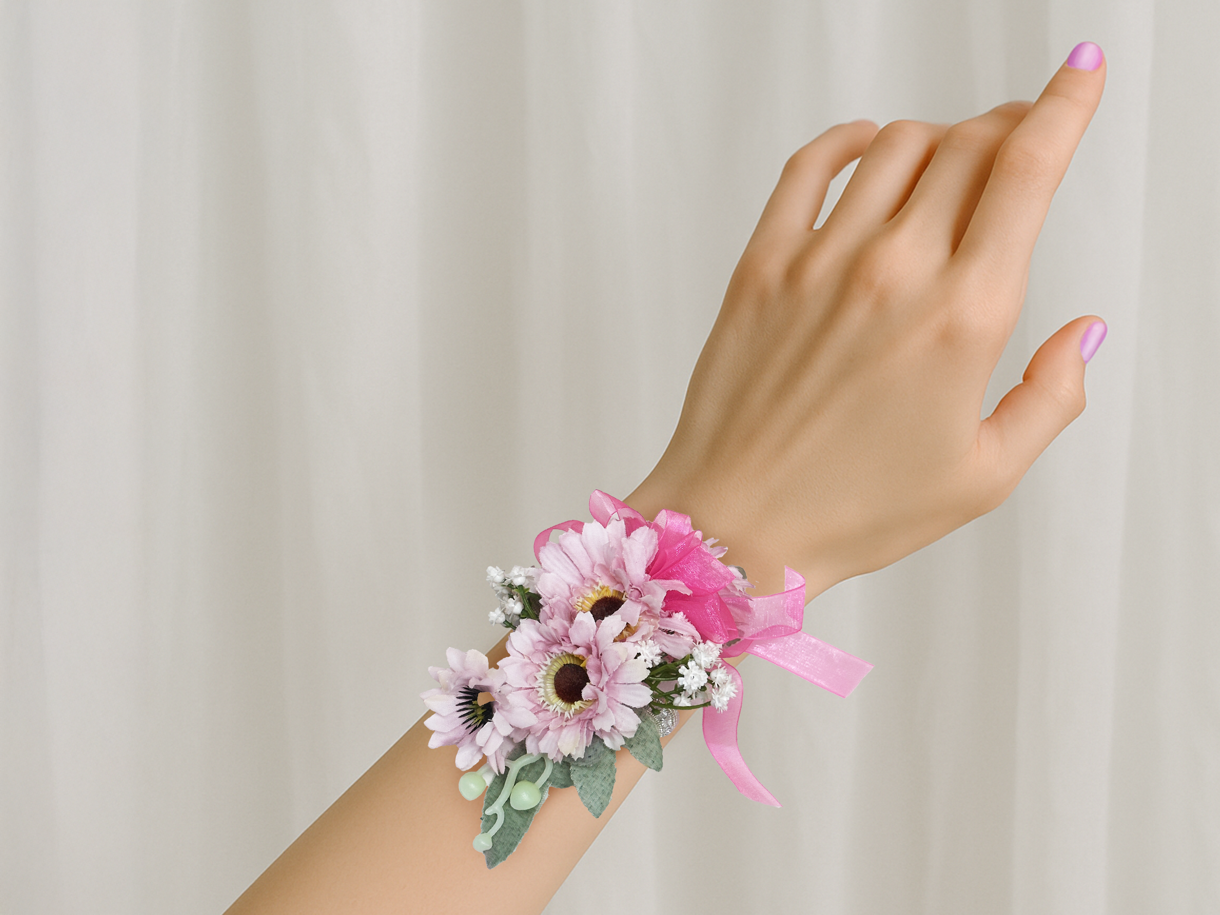 Pink 2 corsage on wrist.png