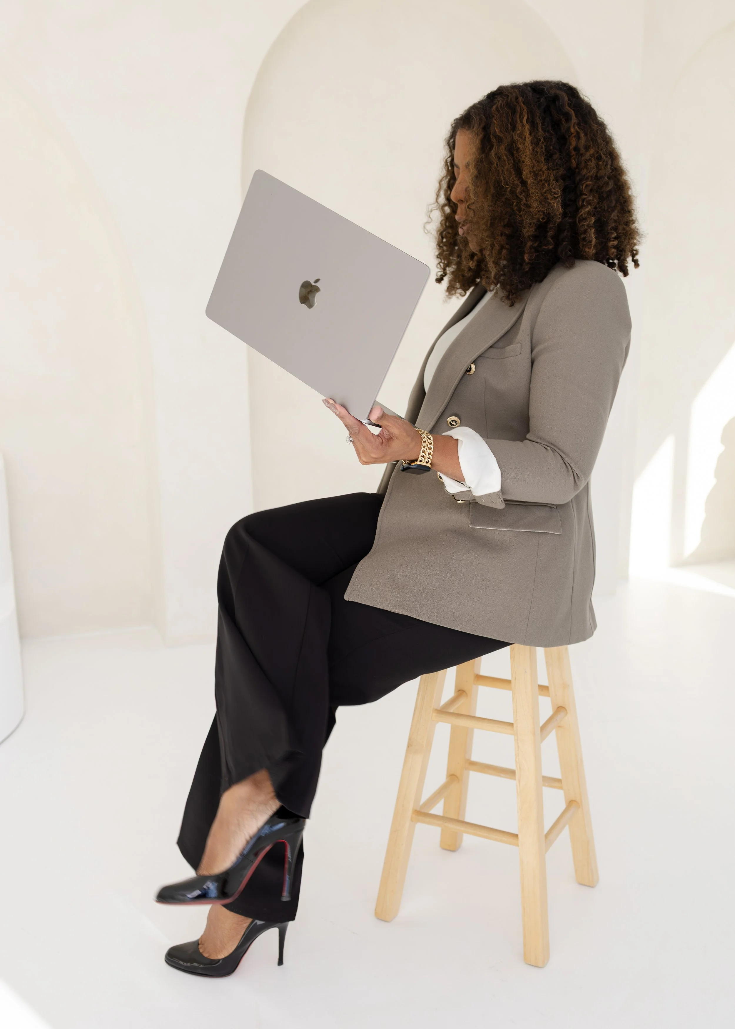 Kendra James Anderson, a Modern accountant working on laptop with marketing strategy