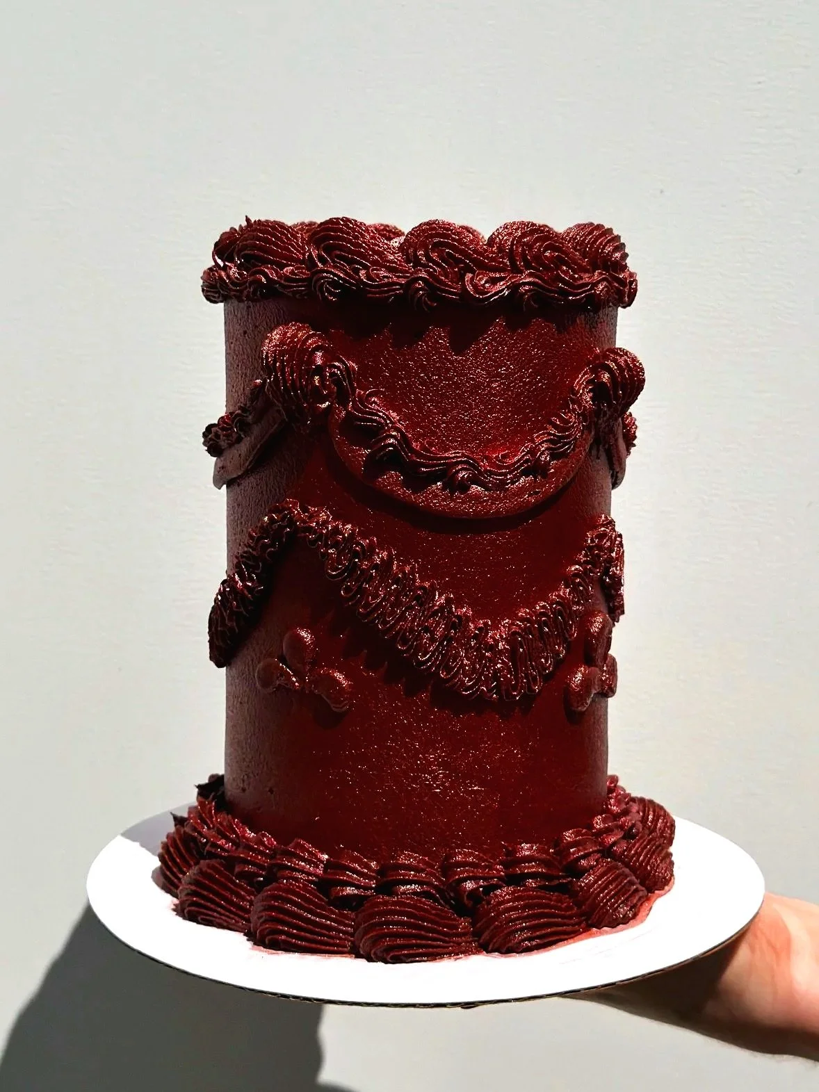 Dark red icing covered in edible glitter