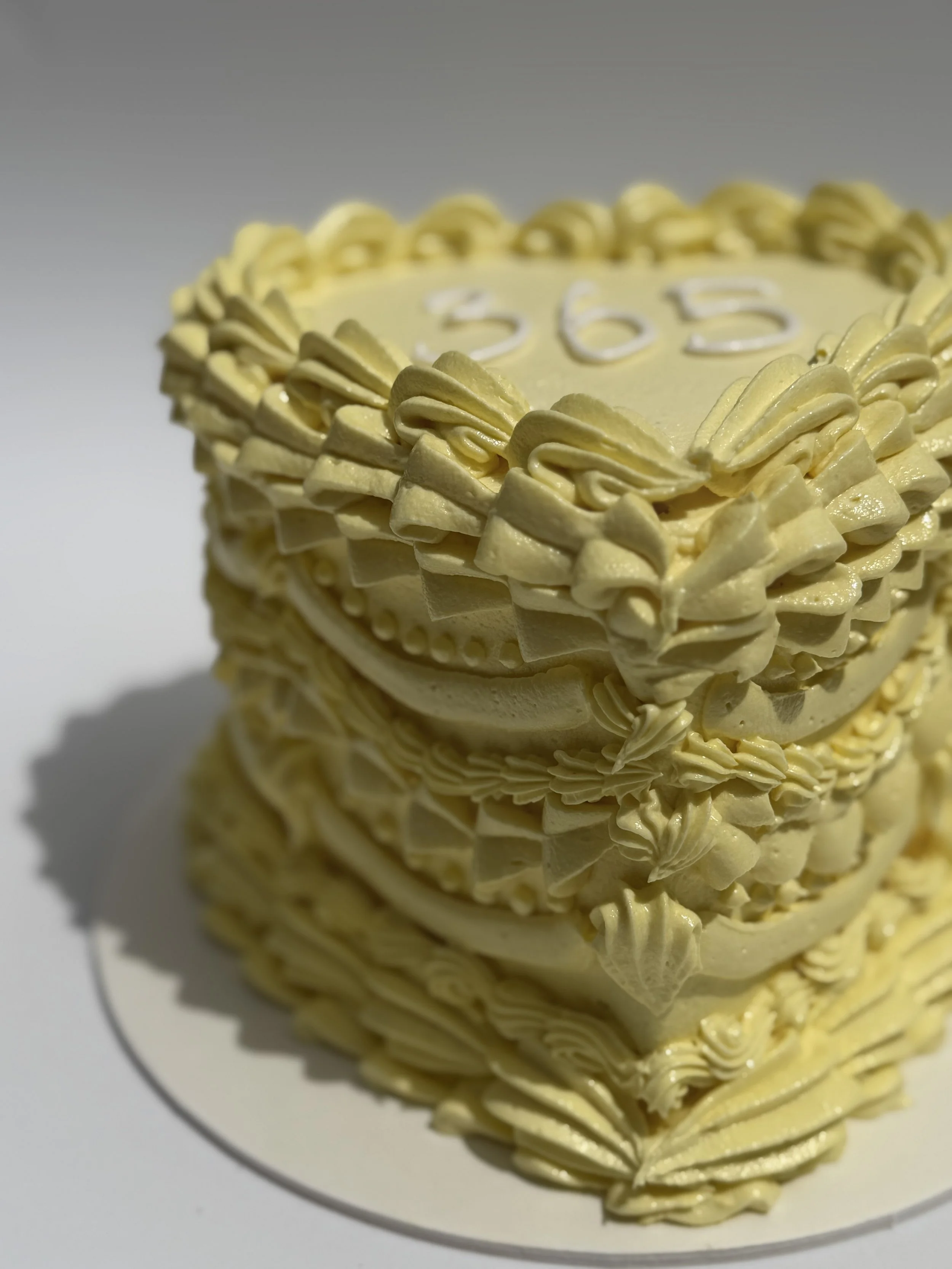 Vintage cake, with "as much piping as possible"