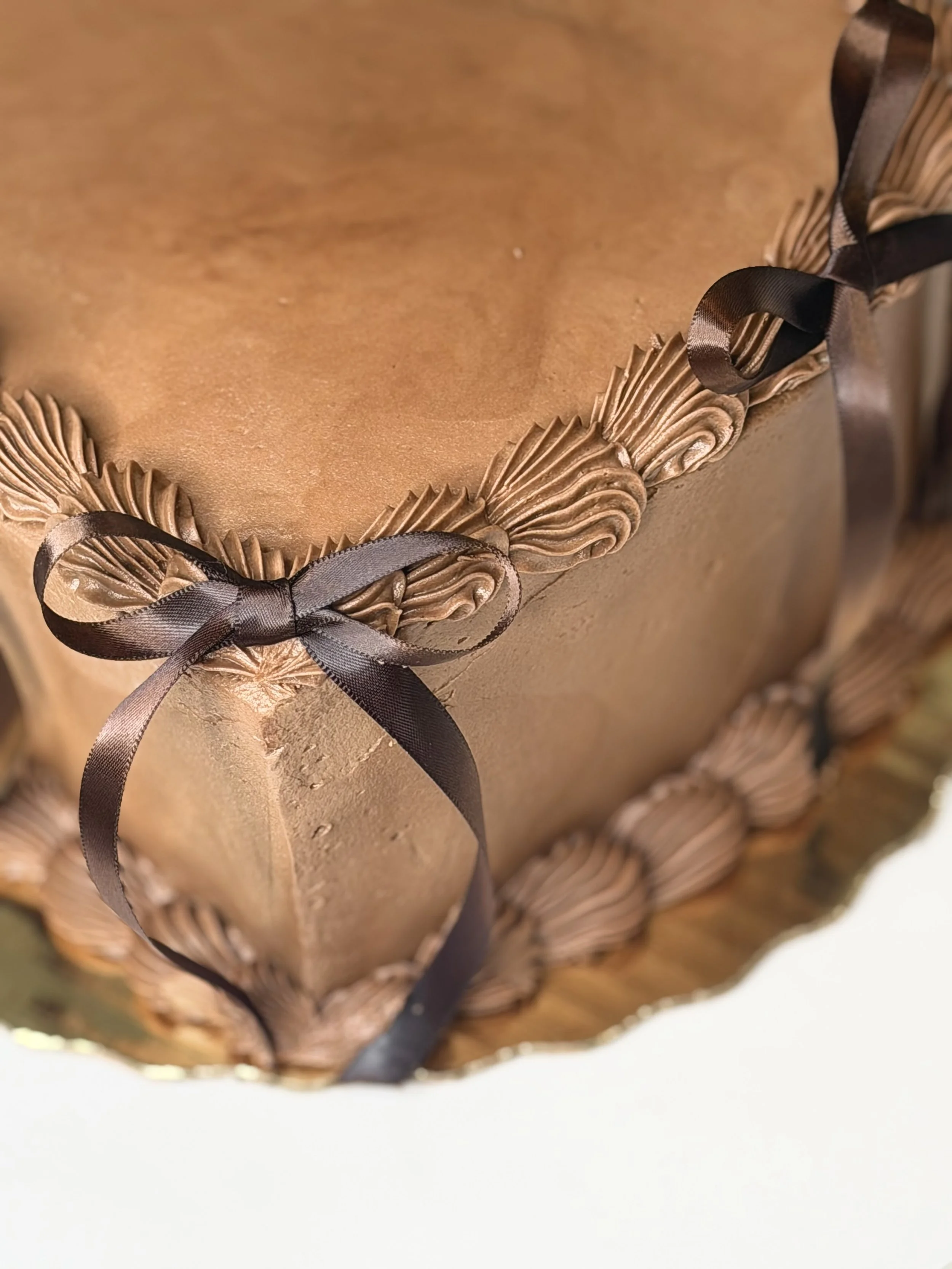 Chocolate cake with a chocolate ganache filling and a whipped ganache icing