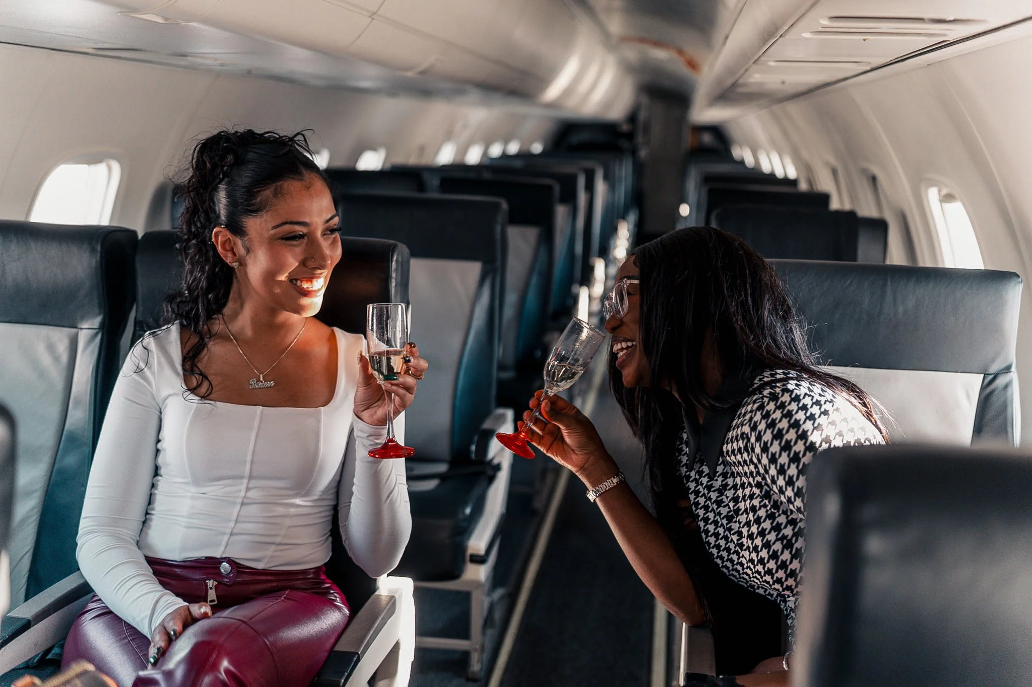 Passengers enjoying a luxury private jet experience with Exodus Aircraft, highlighting comfort, service, and premium travel