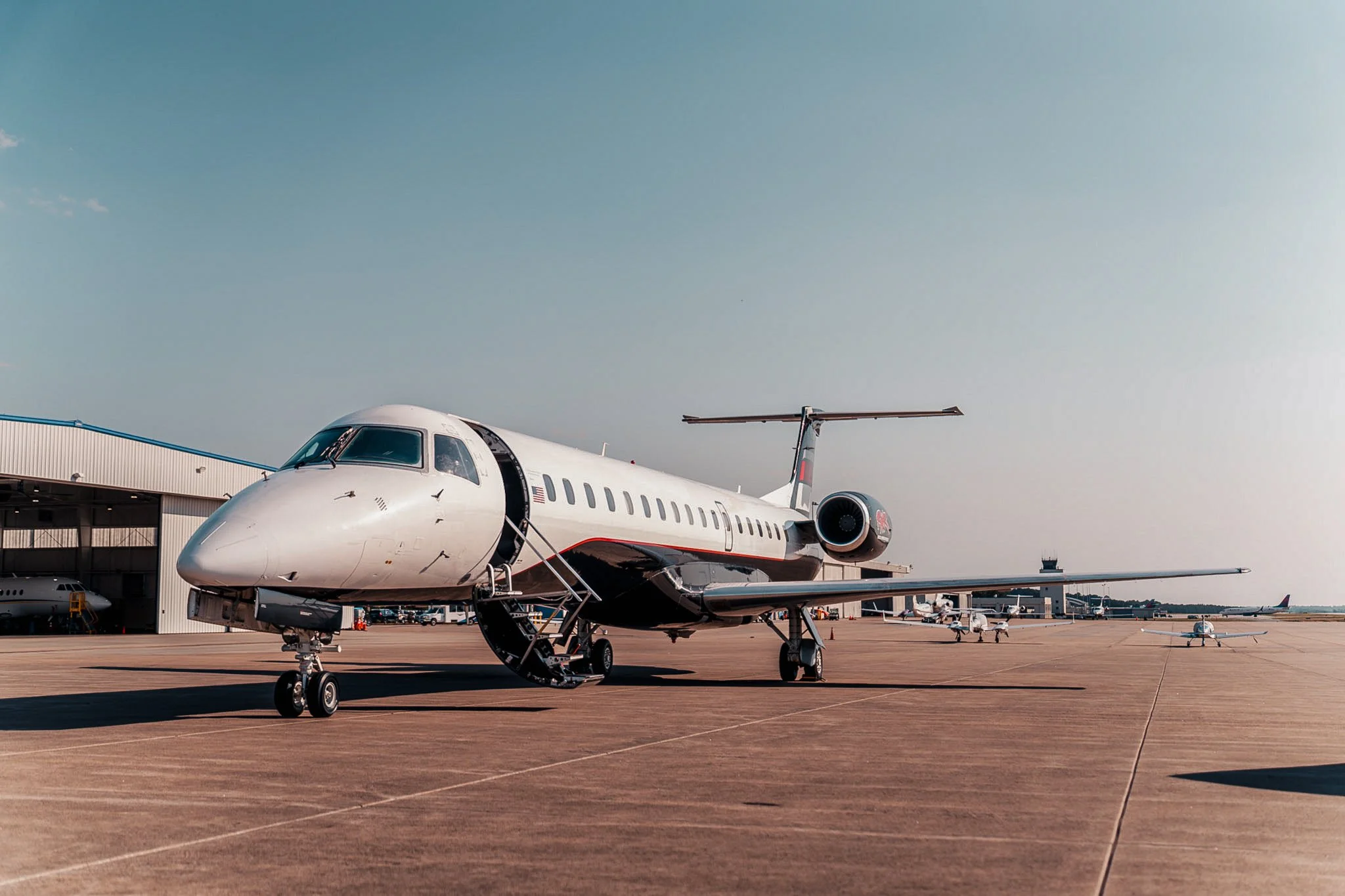 Exodus Aircraft private jet on airport tarmac, highlighting luxury private jet charter services and premium travel