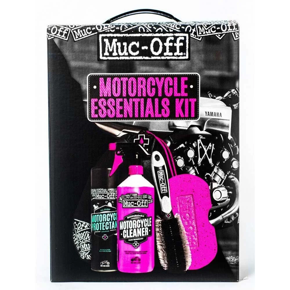 Muc-Off Motorcycle Essentials Kit with cleaning spray, biodegradable motorcycle cleaner, and cleaning sponge, displayed on a black box background.