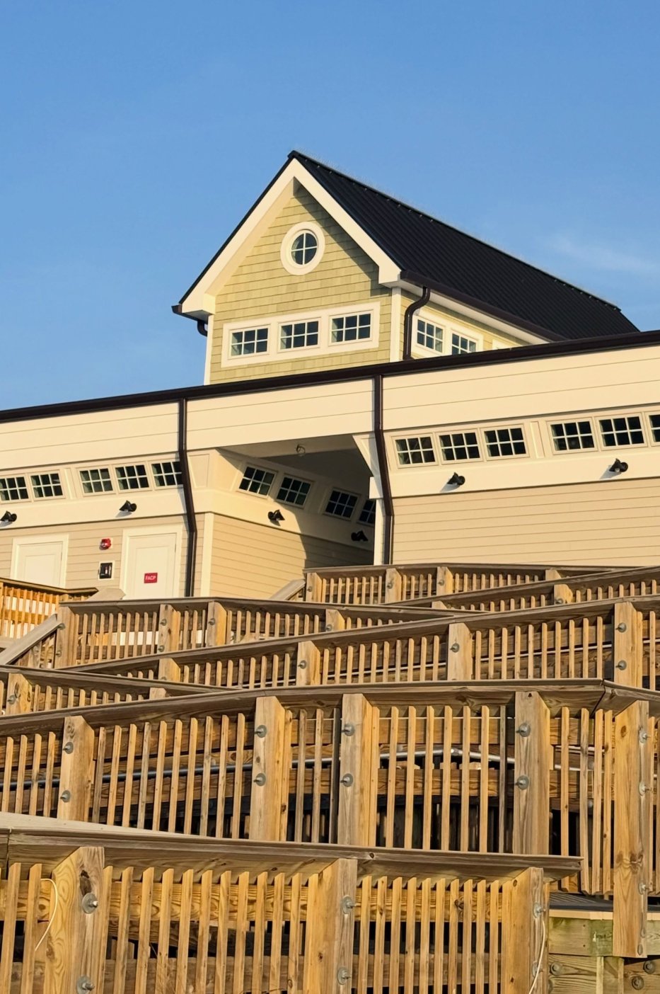 The front of The Beach House with a bright blue clear sky