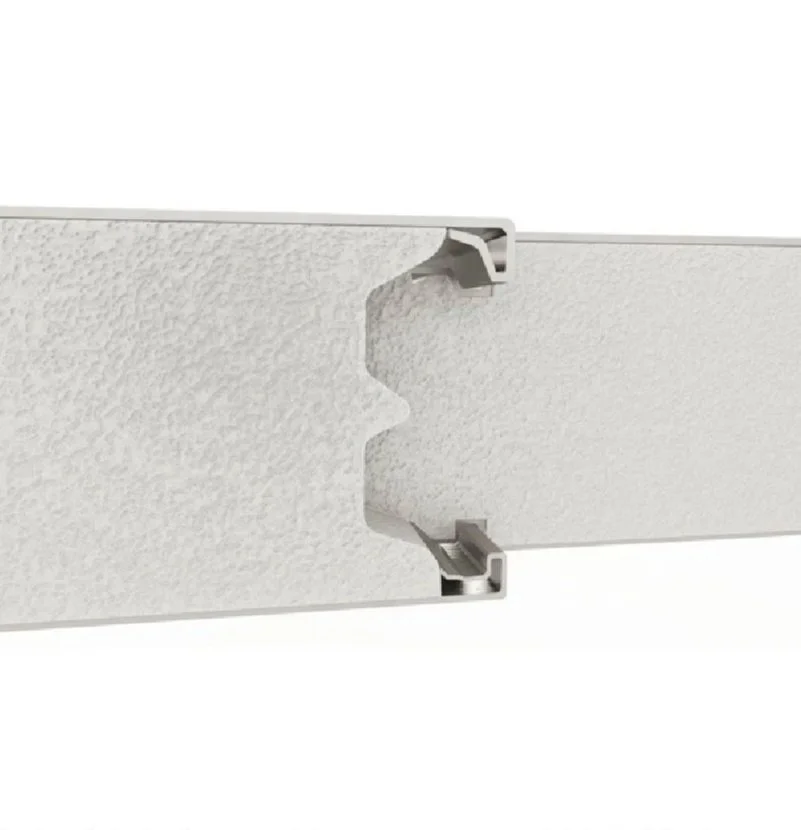 Close-up of a white textured wall panel with a joint connector for mounting or connecting panels.