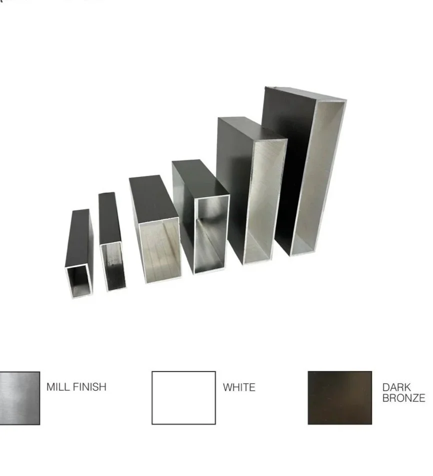 Set of six metal hollow rectangular tubes in varying heights and finishes, including mill finish, white, and dark bronze, arranged from shortest to tallest on a white background.