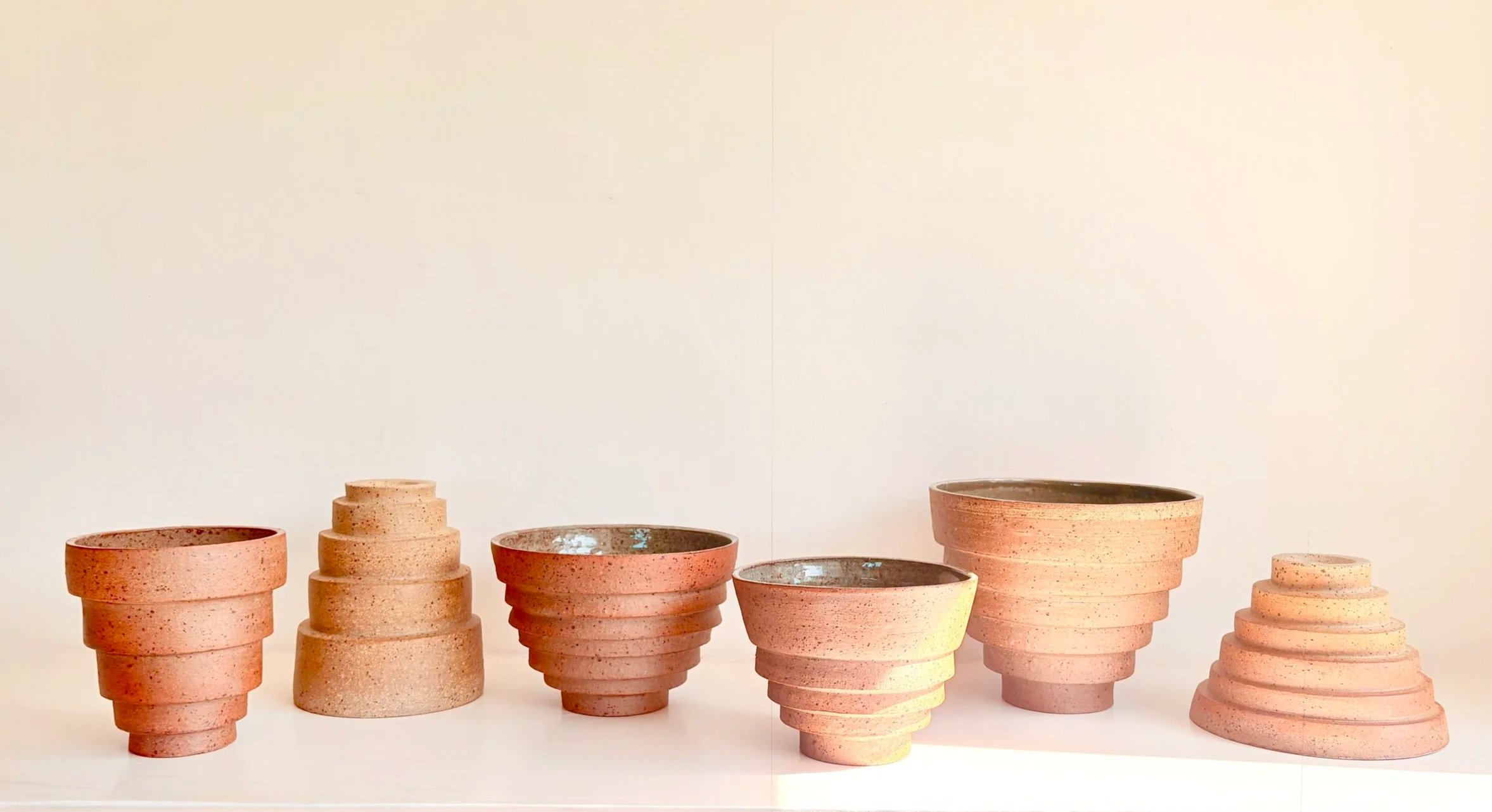 Tiered Earth - a collection of reduction fired bowls and towers/vases thrown on the wheel
