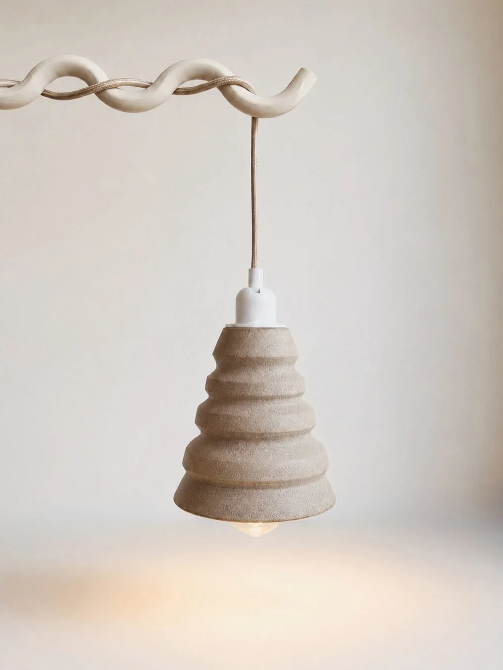 Brut II &mdash; ceramic pendant. Wheel-thrown grey clay with a cotton white glazed interior. 17 cm W &times; 18 cm H.

Developed as part of an ongoing lighting series exploring modular and brutalist-inspired forms. 

I&rsquo;ve been wanting to make t
