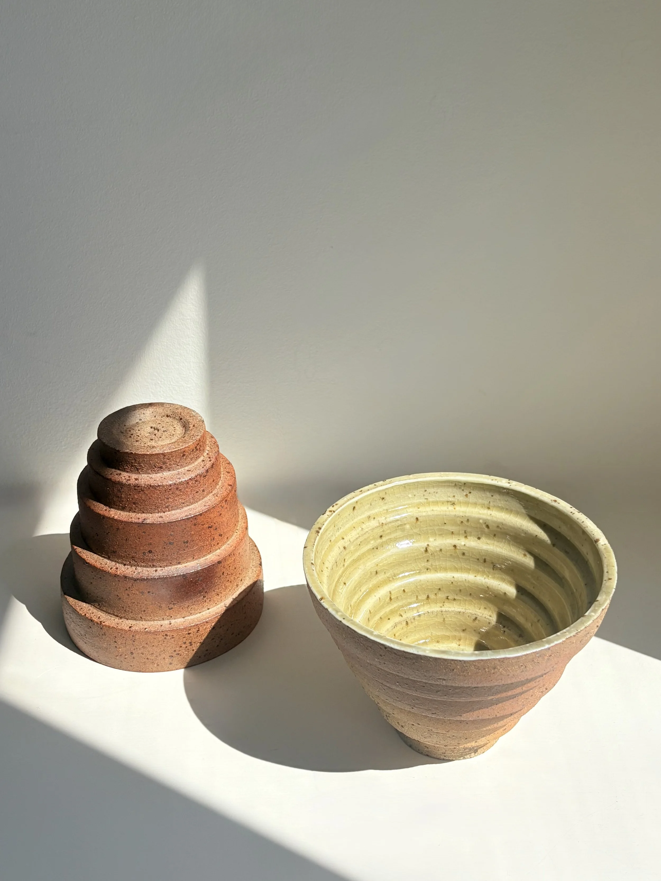 Tiered earth - glazed with porcelain slip and celadon glaze on the inside