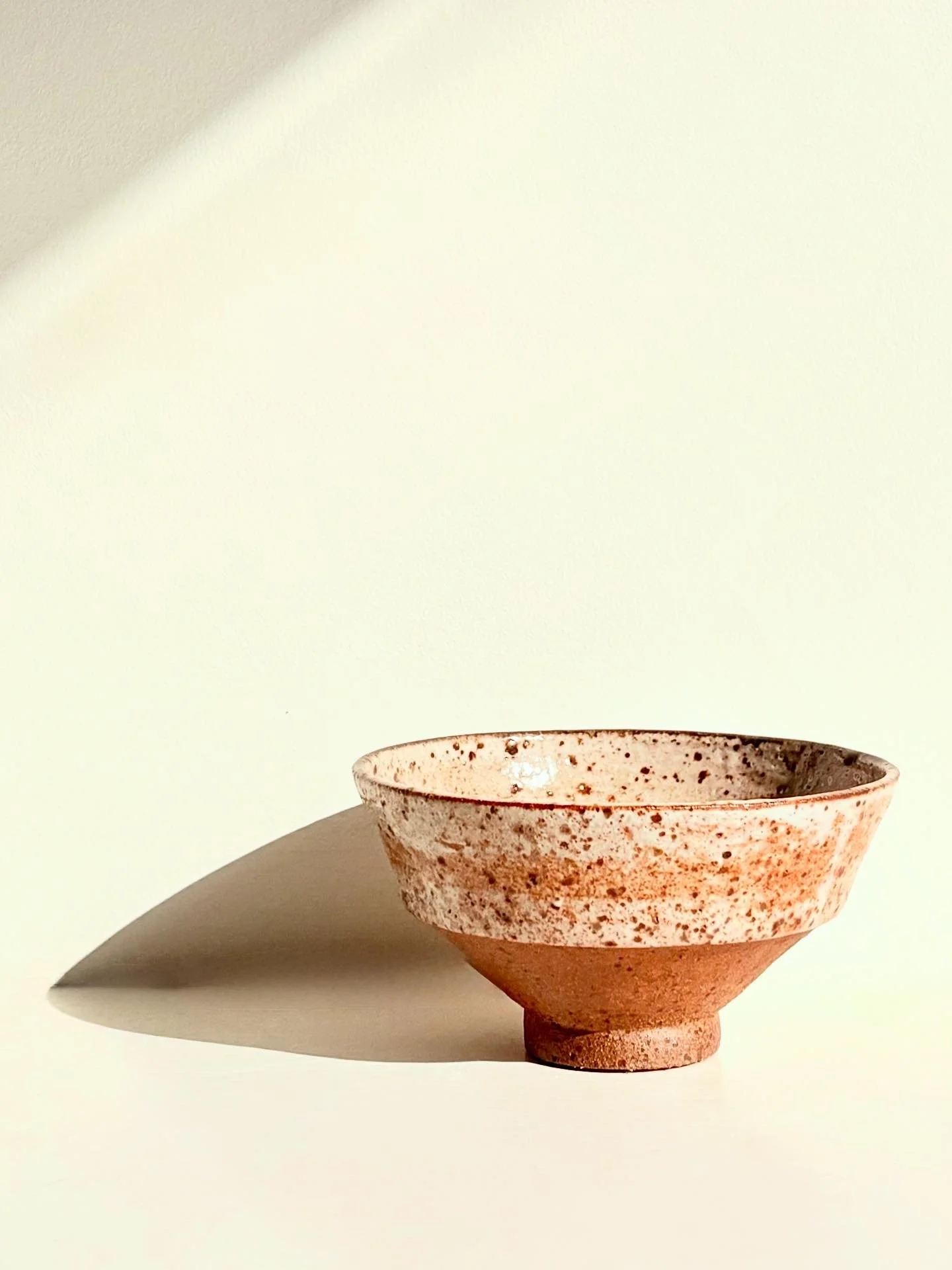 Wood fired angular bowl glazed with orange shino