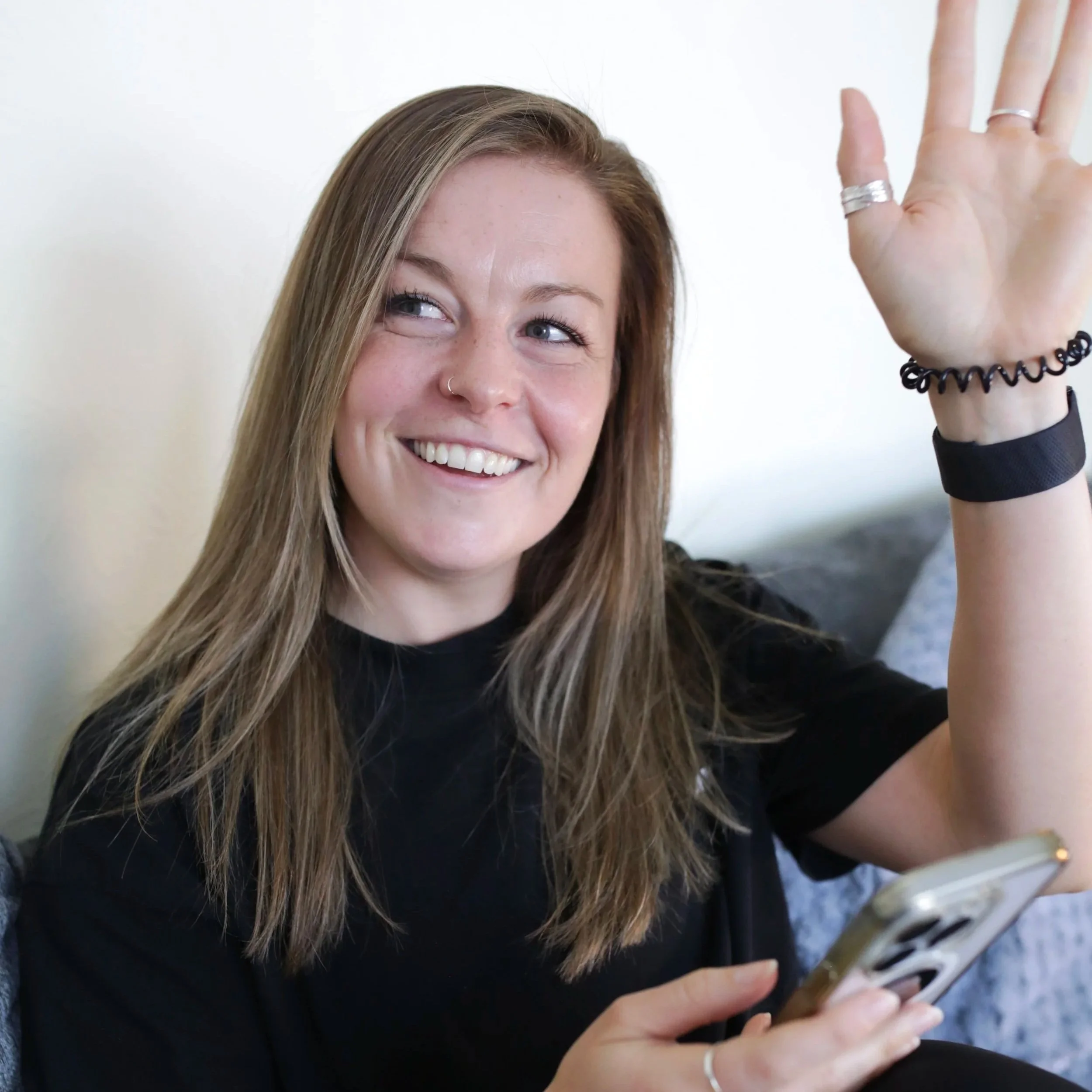 An online coach smiling with confidence to represent approachability and friendliness.