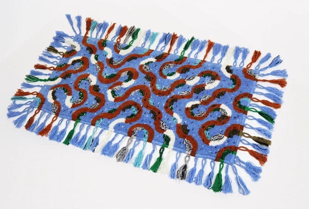 Snakes and tassels rug